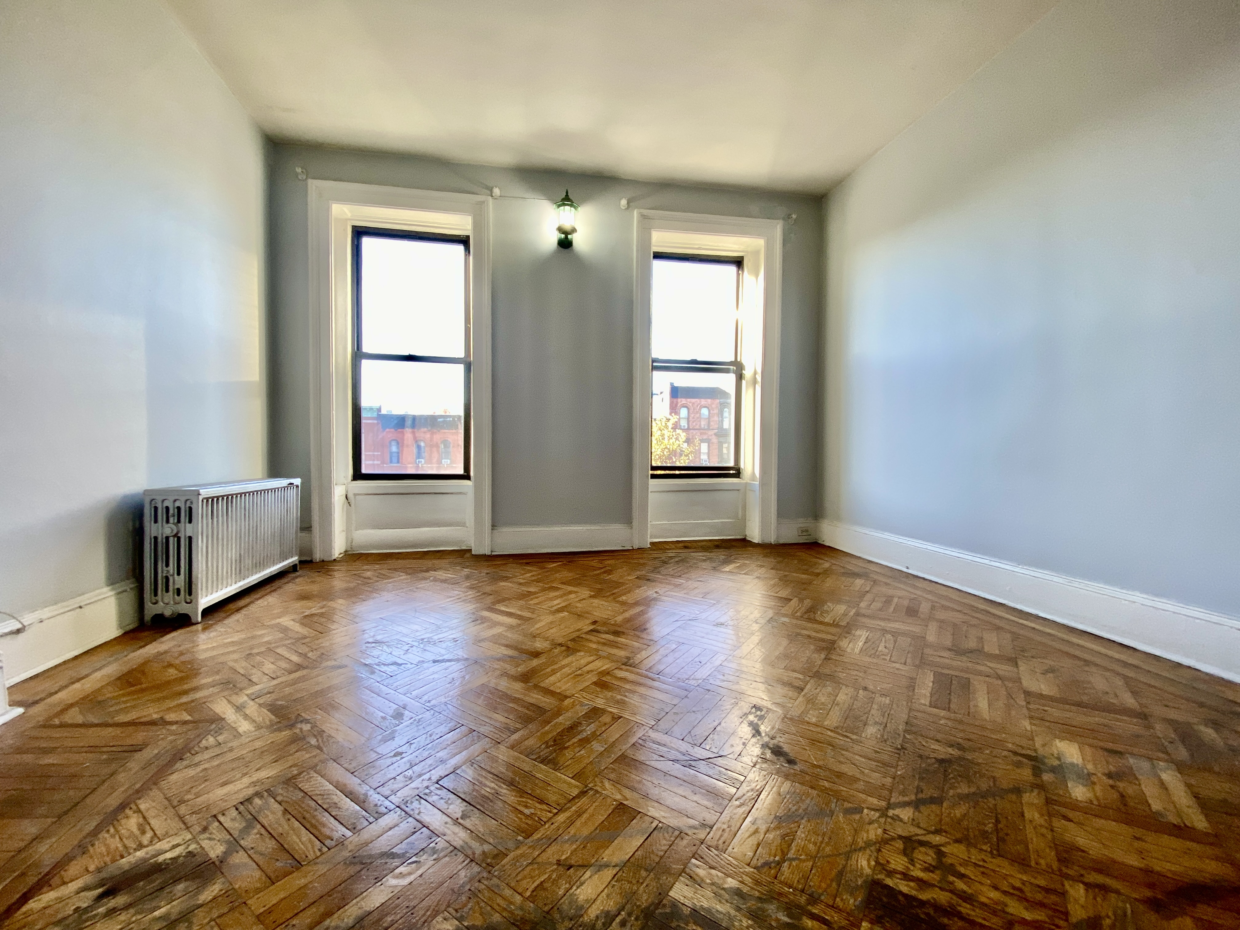 699 4th Avenue, Unit 3 Brooklyn, NY 11232 - Photo 2 of 8 an empty room with windows