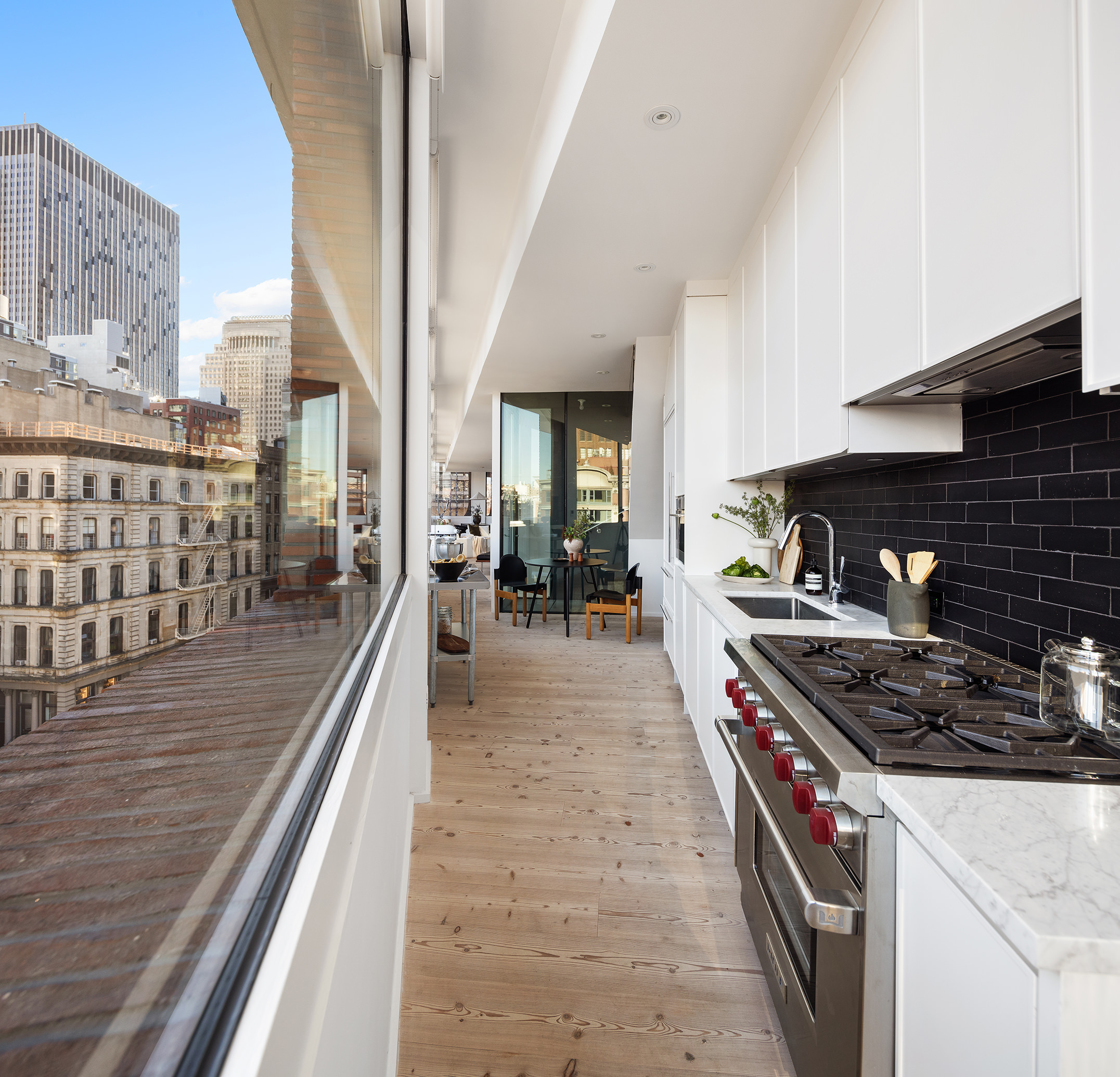 100 Franklin Street, Unit PHS Manhattan, NY 10013 - Photo 15 of 35 a kitchen with stove and cabinets