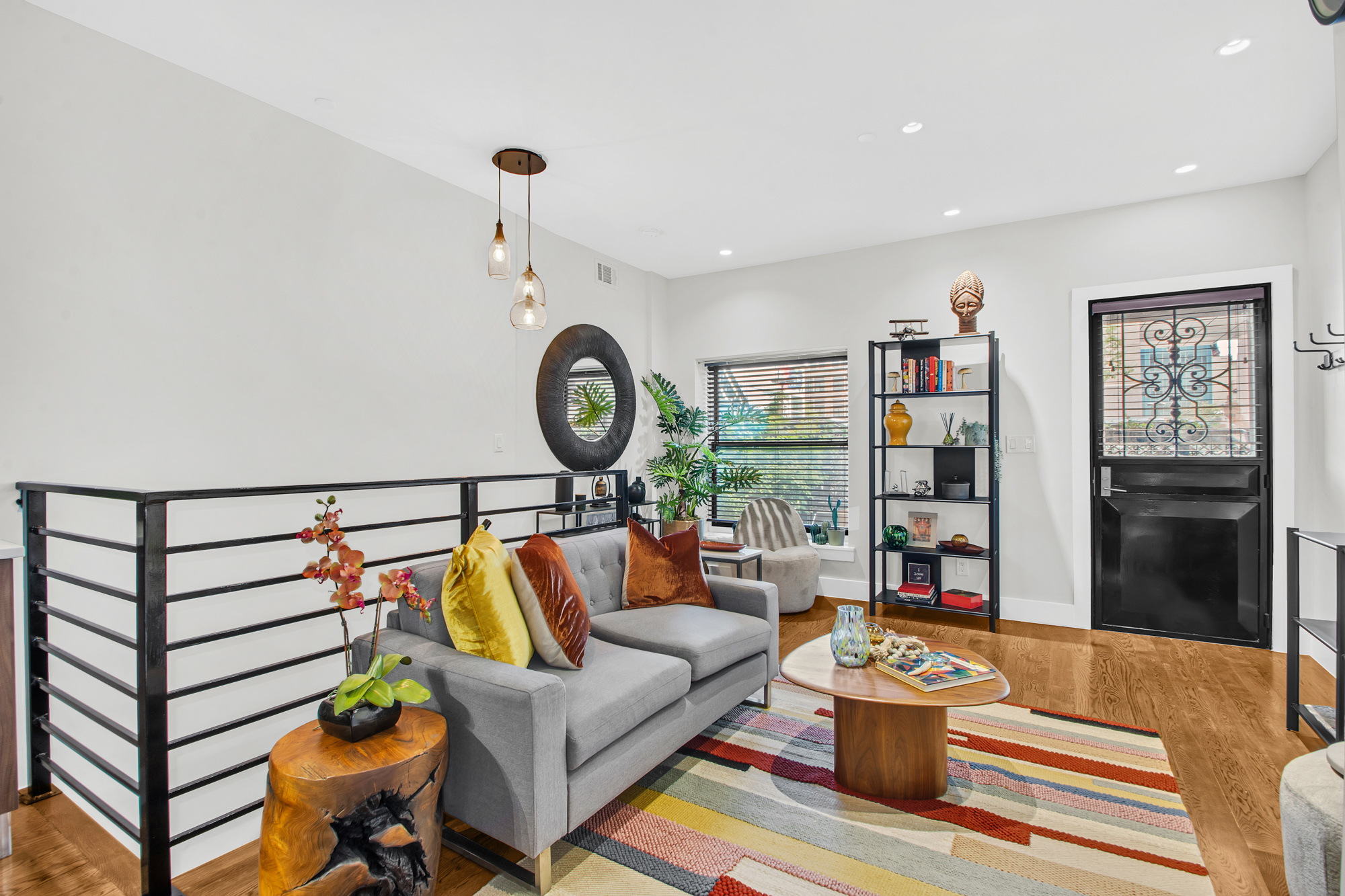 159 West 126th Street, Unit GARDEN A Manhattan, NY 10027 - Photo 3 of 15 a living room with furniture and a window