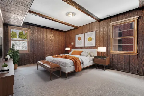 a spacious bedroom with a bed and a window