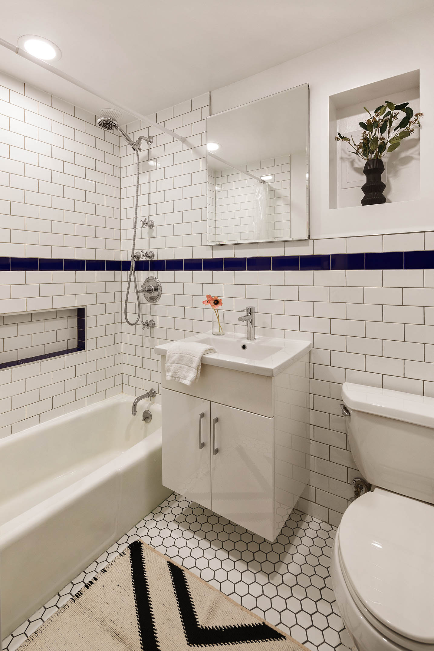 151 West 80th Street, Unit 5R Manhattan, NY 10024 - Photo 8 of 10 a bathroom with a sink toilet and shower