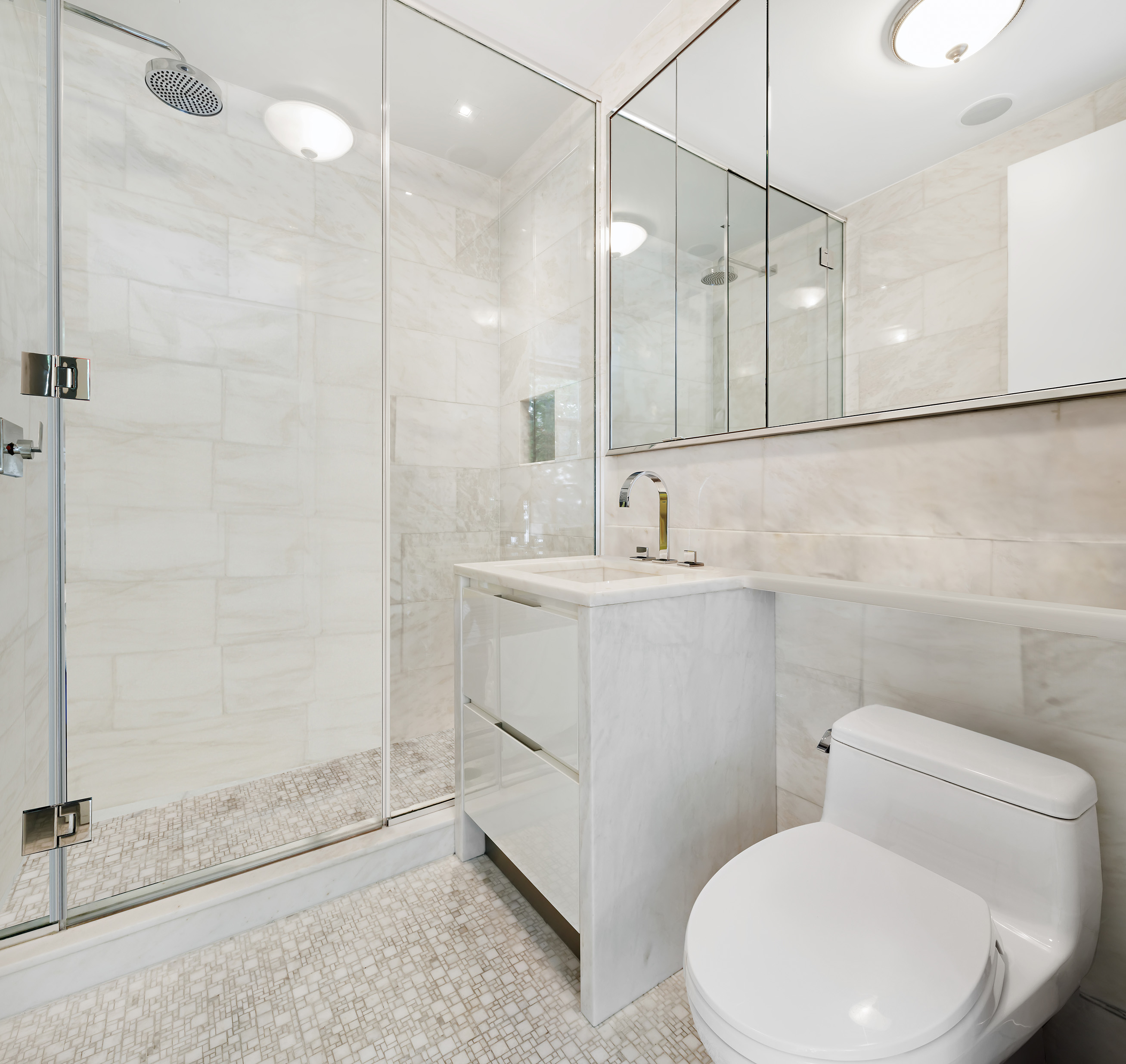 1055 Park Avenue, Unit 1 Manhattan, NY 10028 - Photo 17 of 19 a bathroom with a sink a toilet and shower