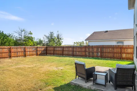 a view of a yard with a lake view