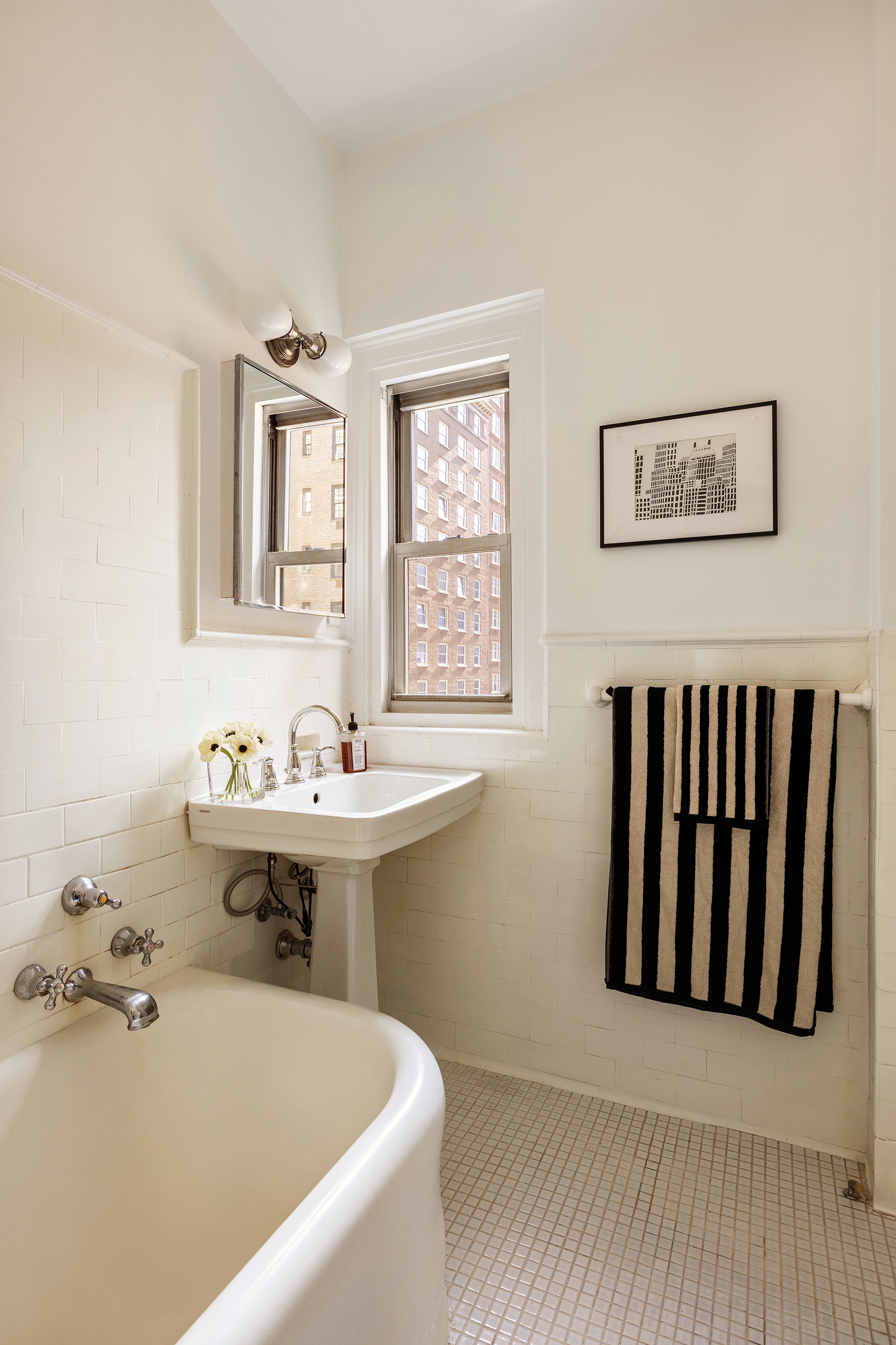 30 5th Avenue, Unit 6H Manhattan, NY 10011 - Photo 9 of 17 a bathroom with a sink and a bathtub