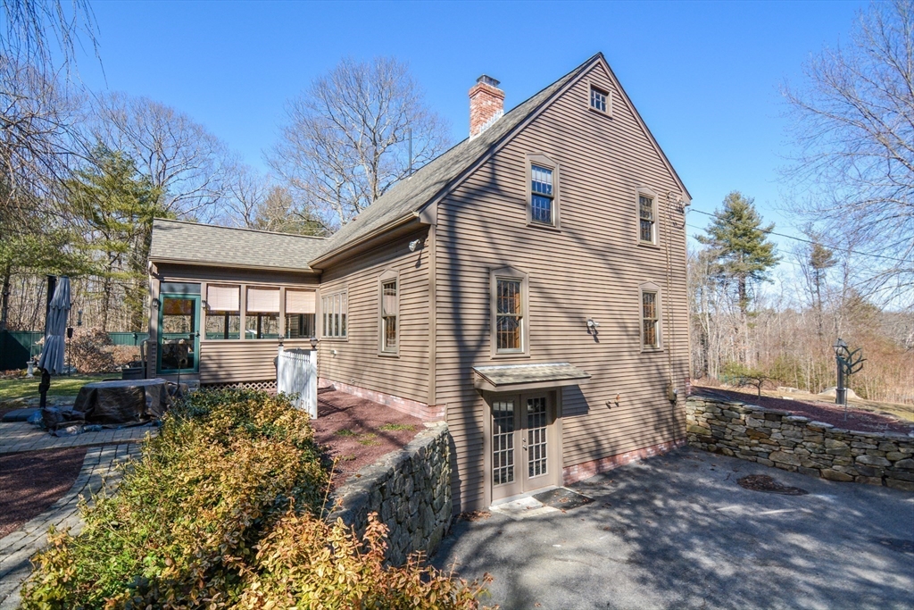187 Blackstone Street Mendon, MA 01756 - Photo 6 of 42 a front view of a house with garden