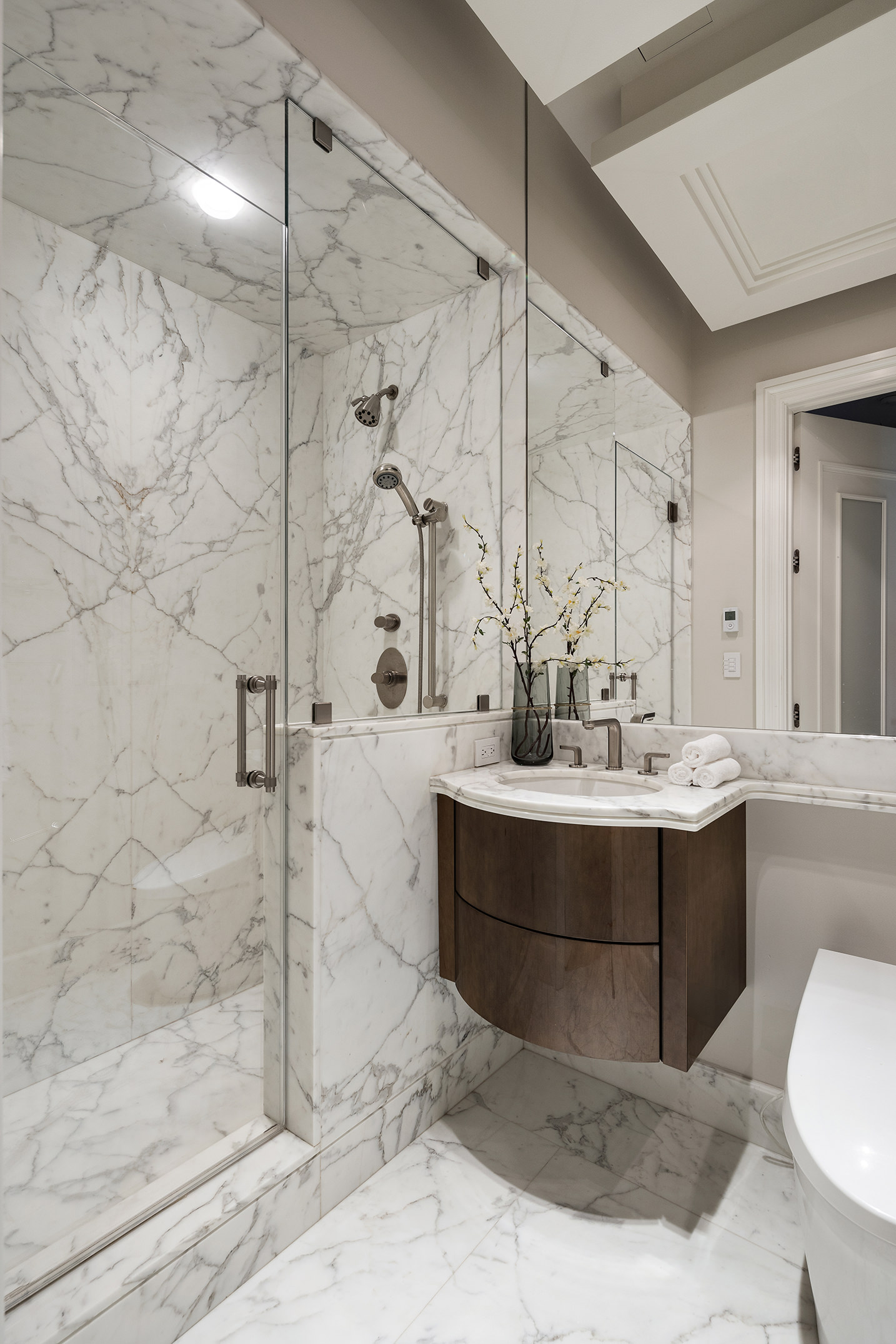 1 Central Park South, Unit 801 Manhattan, NY 10019 - Photo 14 of 21 a bathroom with a tub sink shower and mirror