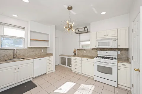 a kitchen with a refrigerator a sink and dishwasher