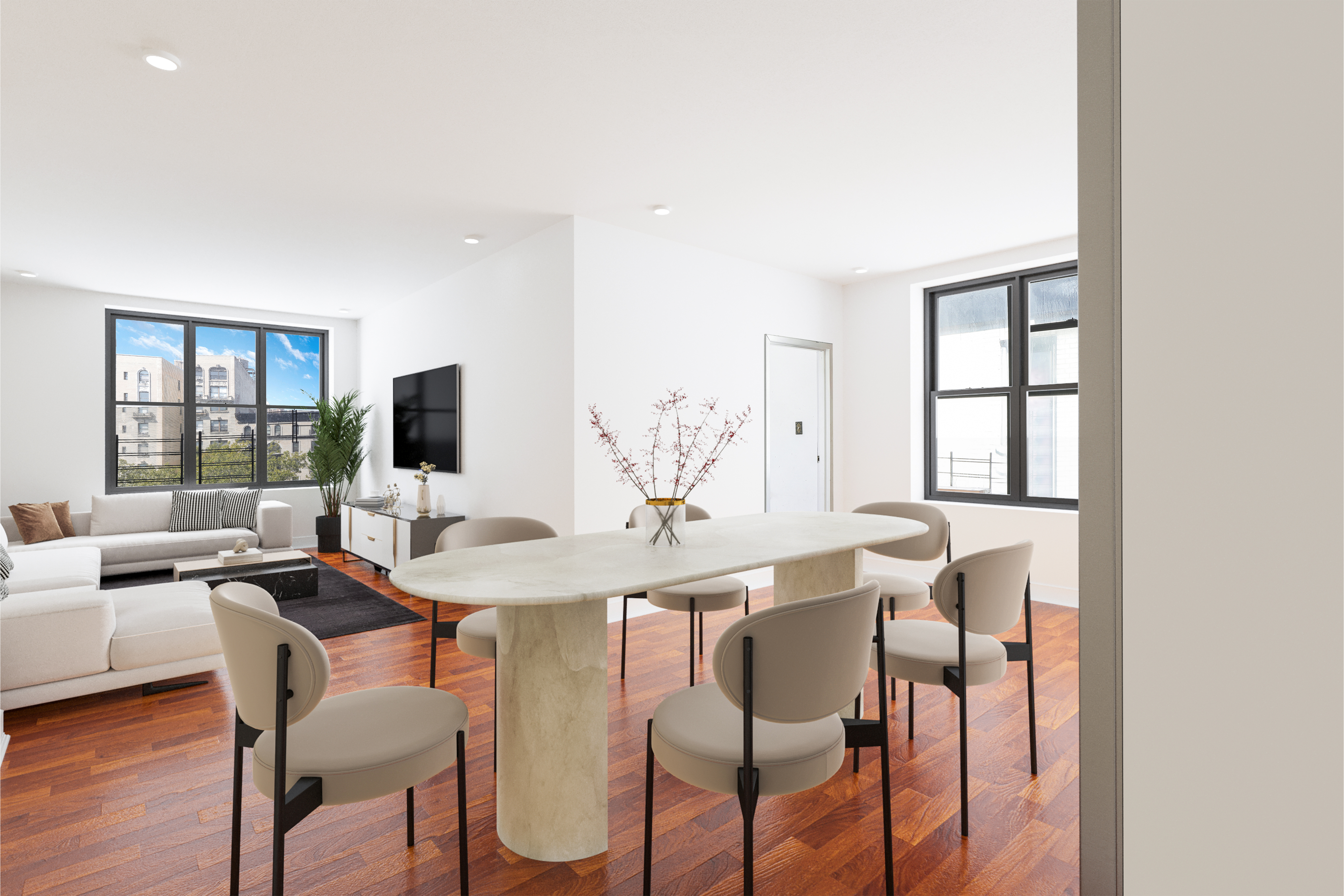 a view of a dining room with furniture and wooden floor
