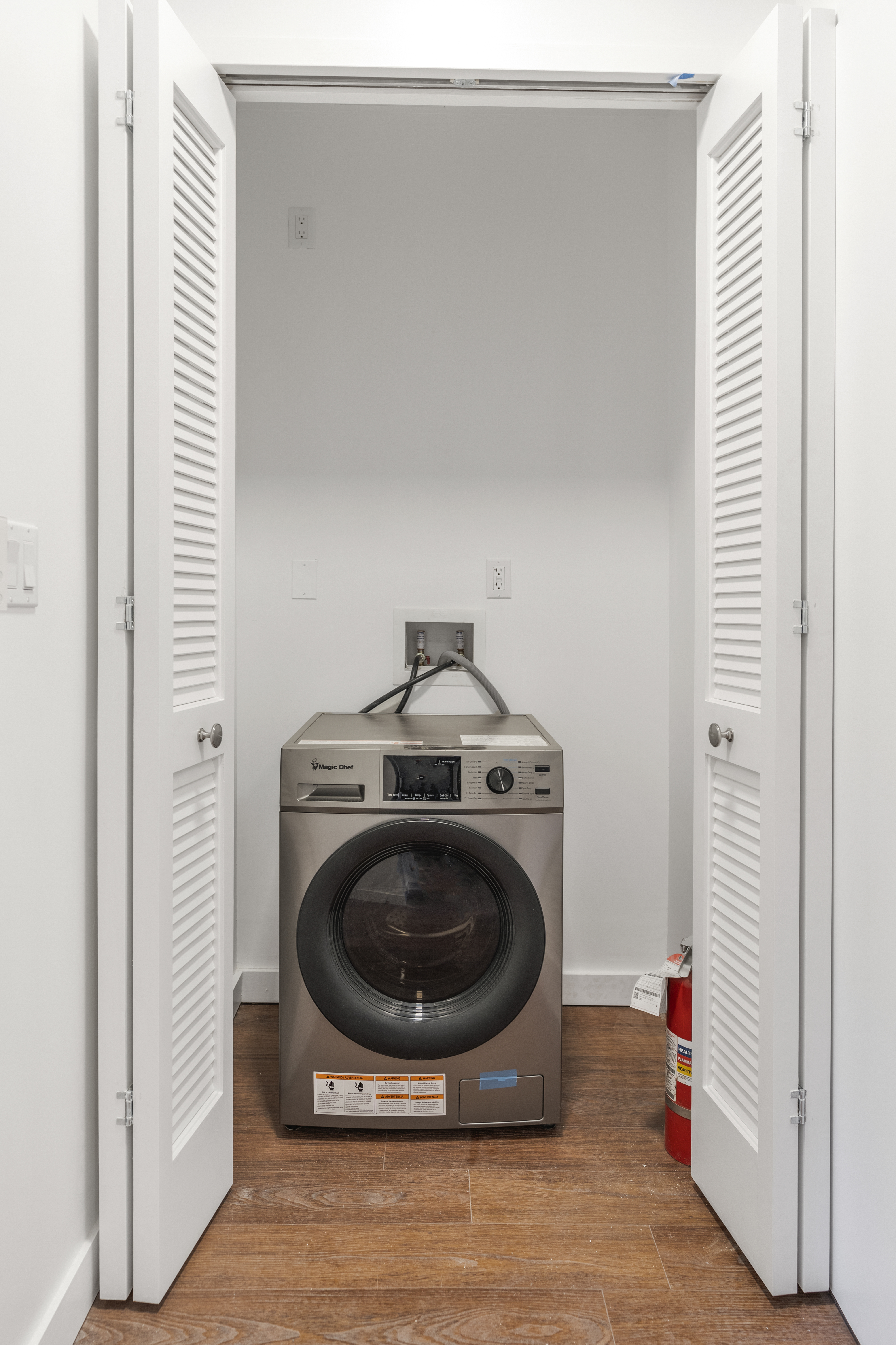 406 West 52nd Street, Unit 2 Manhattan, NY 10019 - Photo 8 of 9 a utility room with washing machine
