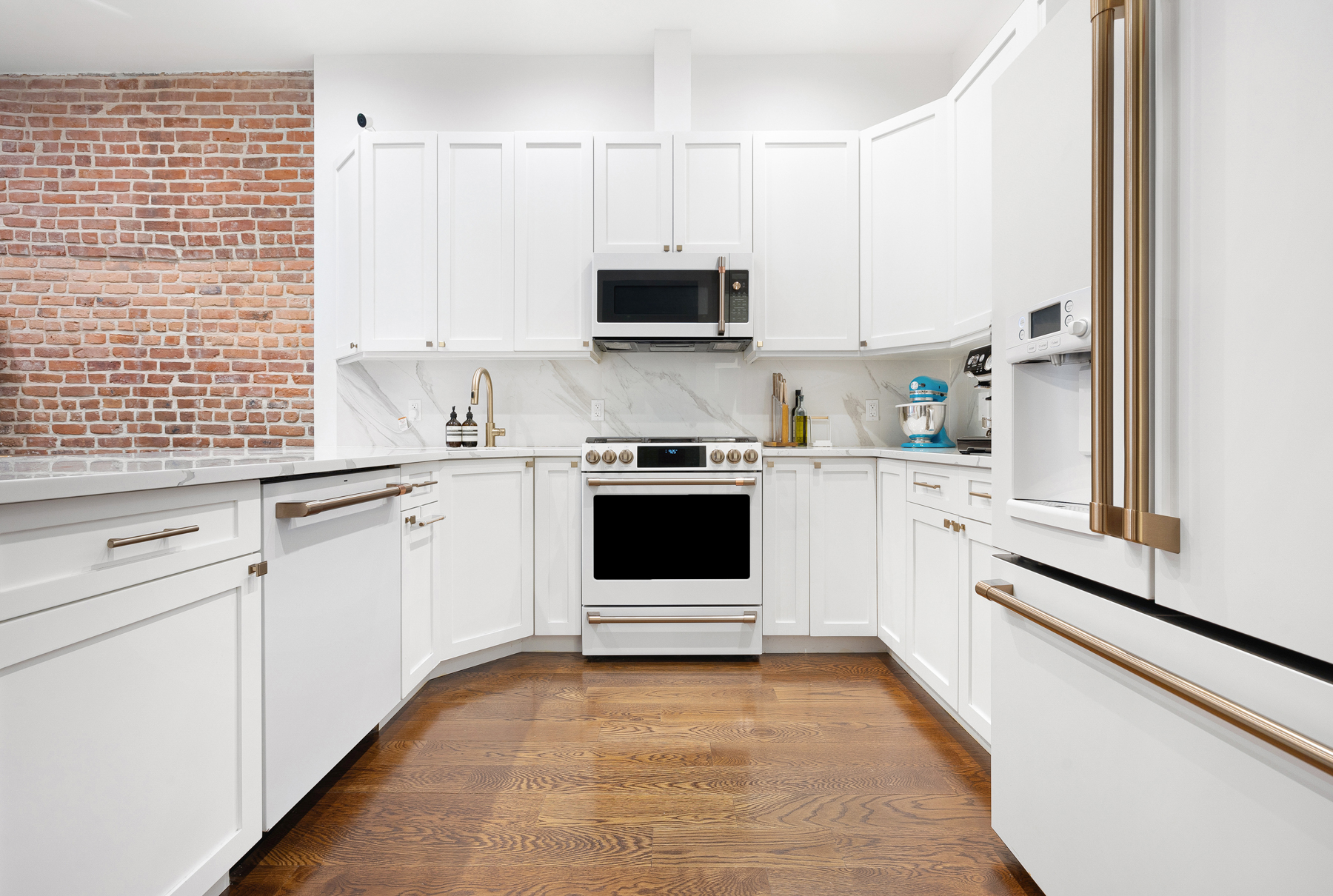 110 Summit Street, Unit 2 Brooklyn, NY 11231 - Photo 5 of 13 a kitchen with stainless steel appliances a stove sink and microwave