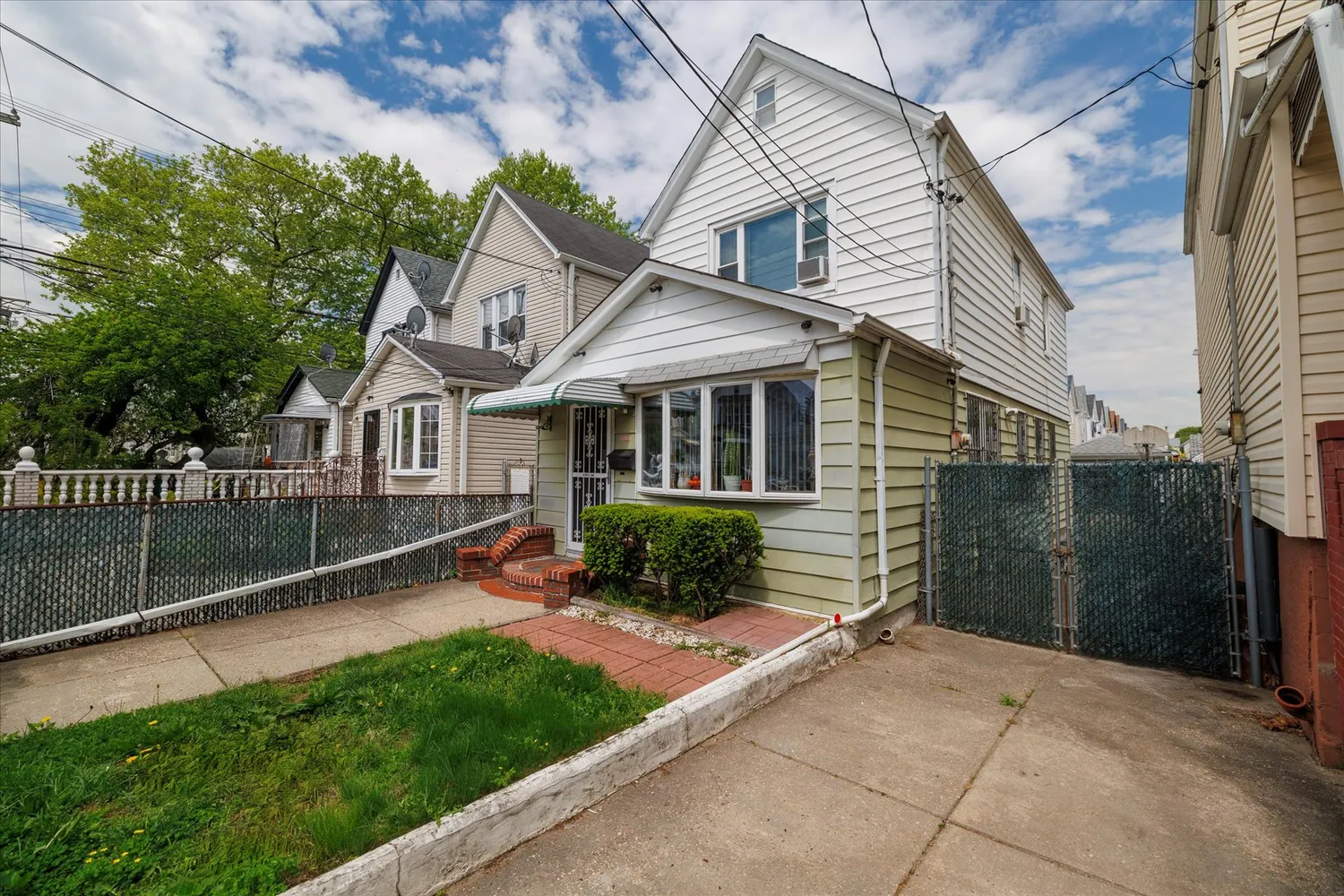 a view of house with a yard