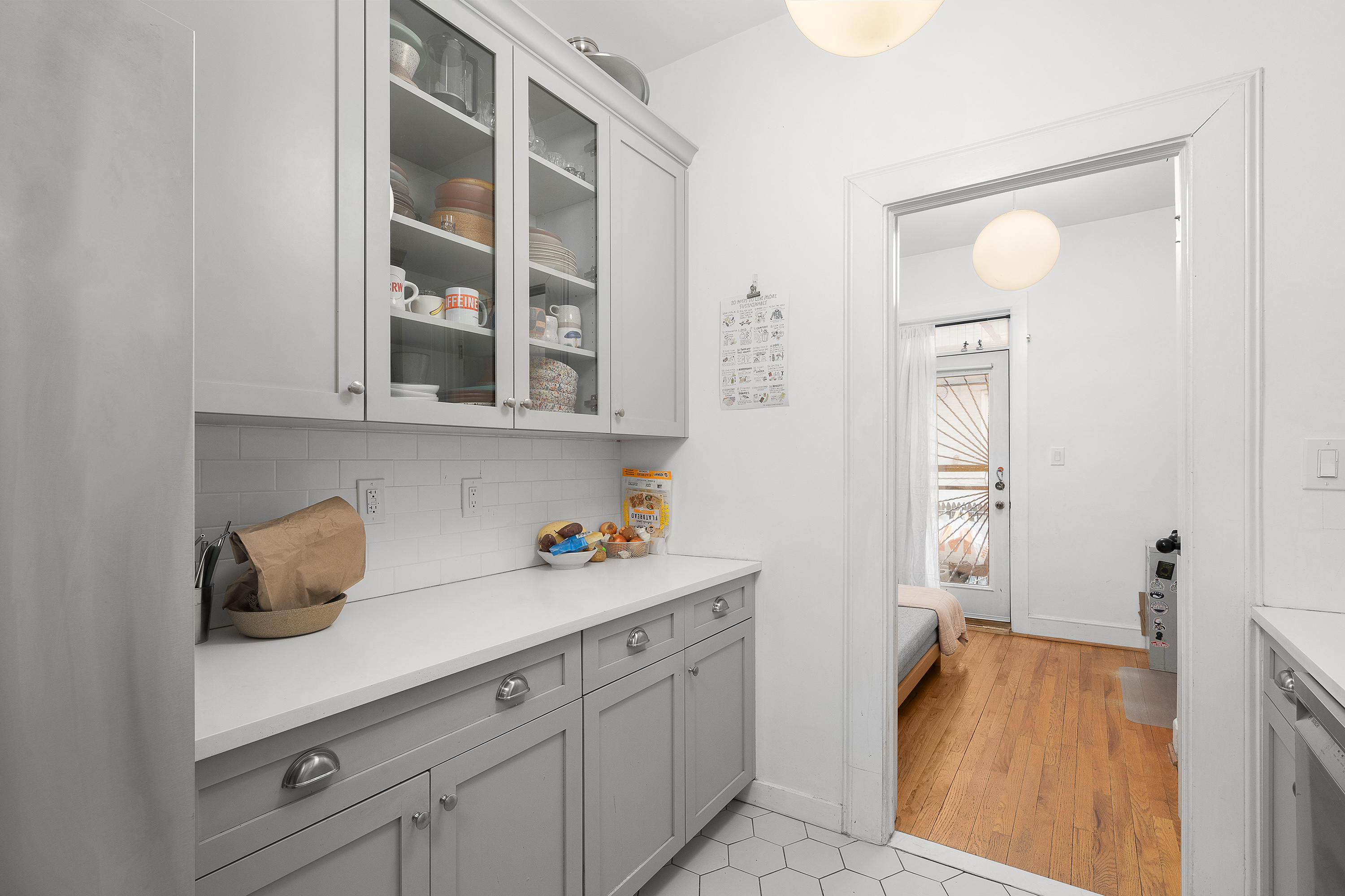 226 St James Place, Unit 1R Brooklyn, NY 11238 - Photo 7 of 14 a kitchen with a sink and cabinets