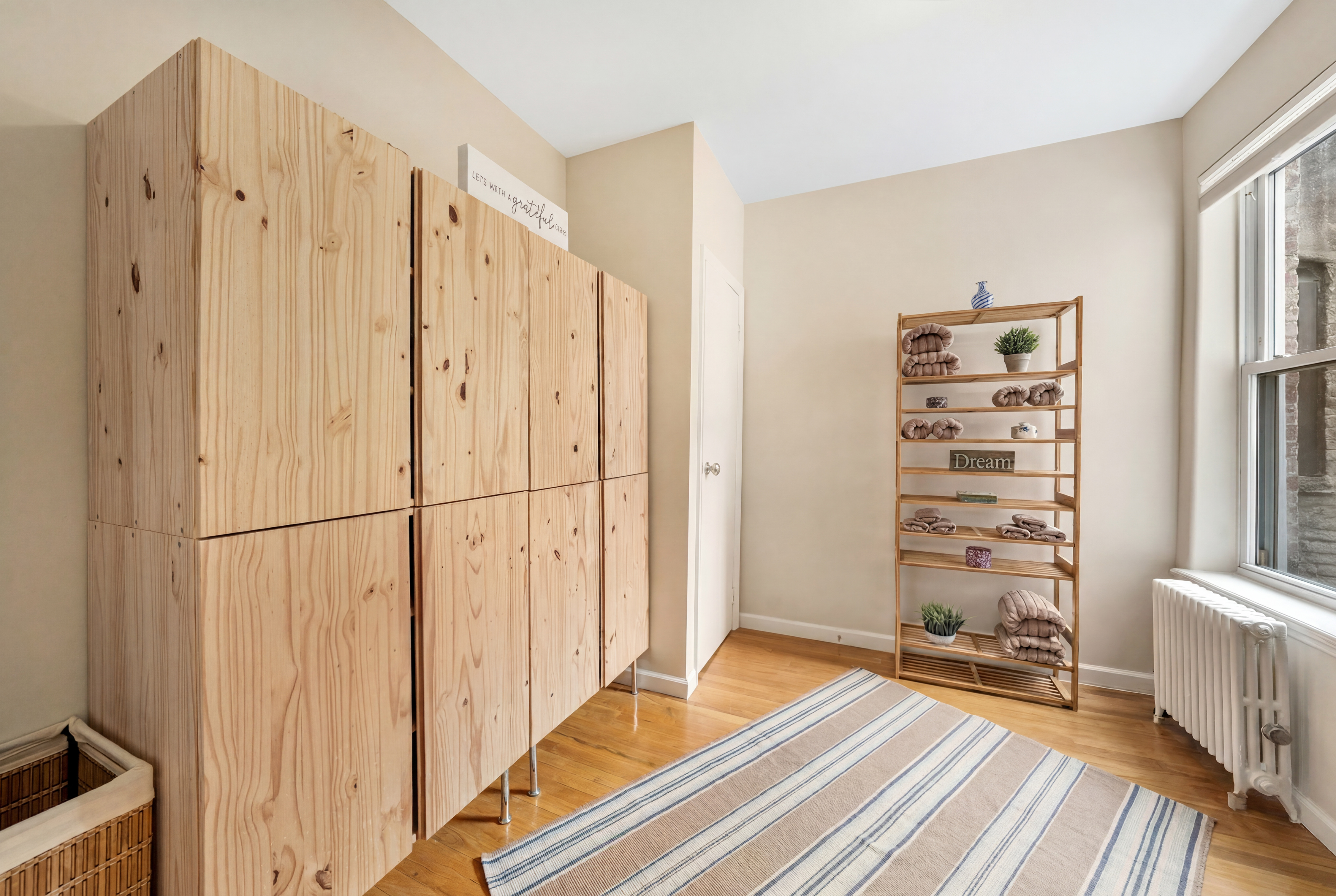 1286 Halsey Street, Unit 3B Brooklyn, NY 11237 - Photo 4 of 10 a view of a bedroom with wooden floor and chair