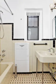 a bathroom with a sink a toilet and a bathtub