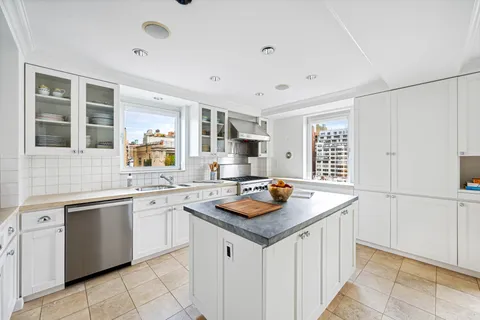 a living room with furniture a rug and a fireplace