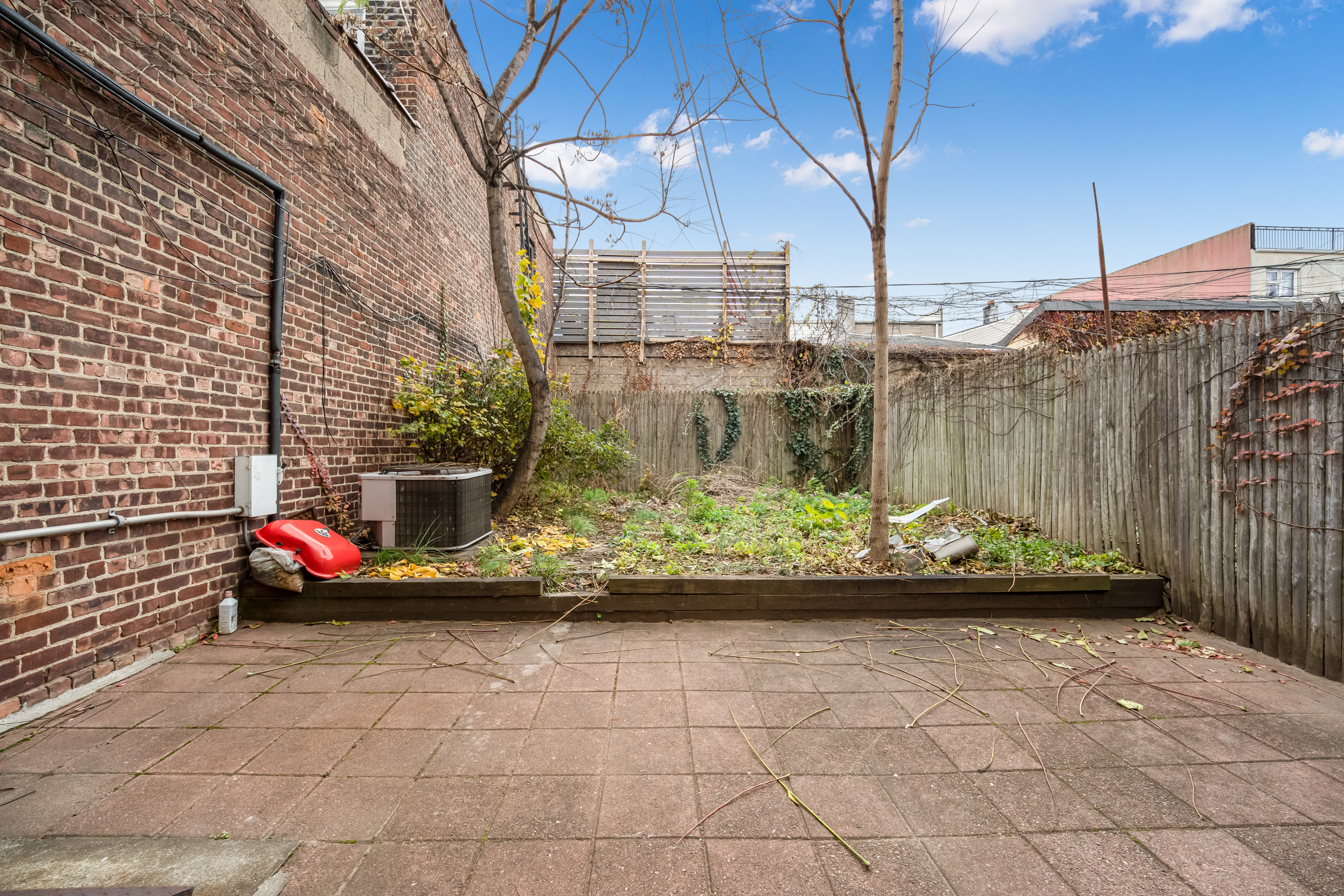 62-22 Myrtle Avenue Queens, NY 11385 - Photo 7 of 13 a view of outdoor space with cars