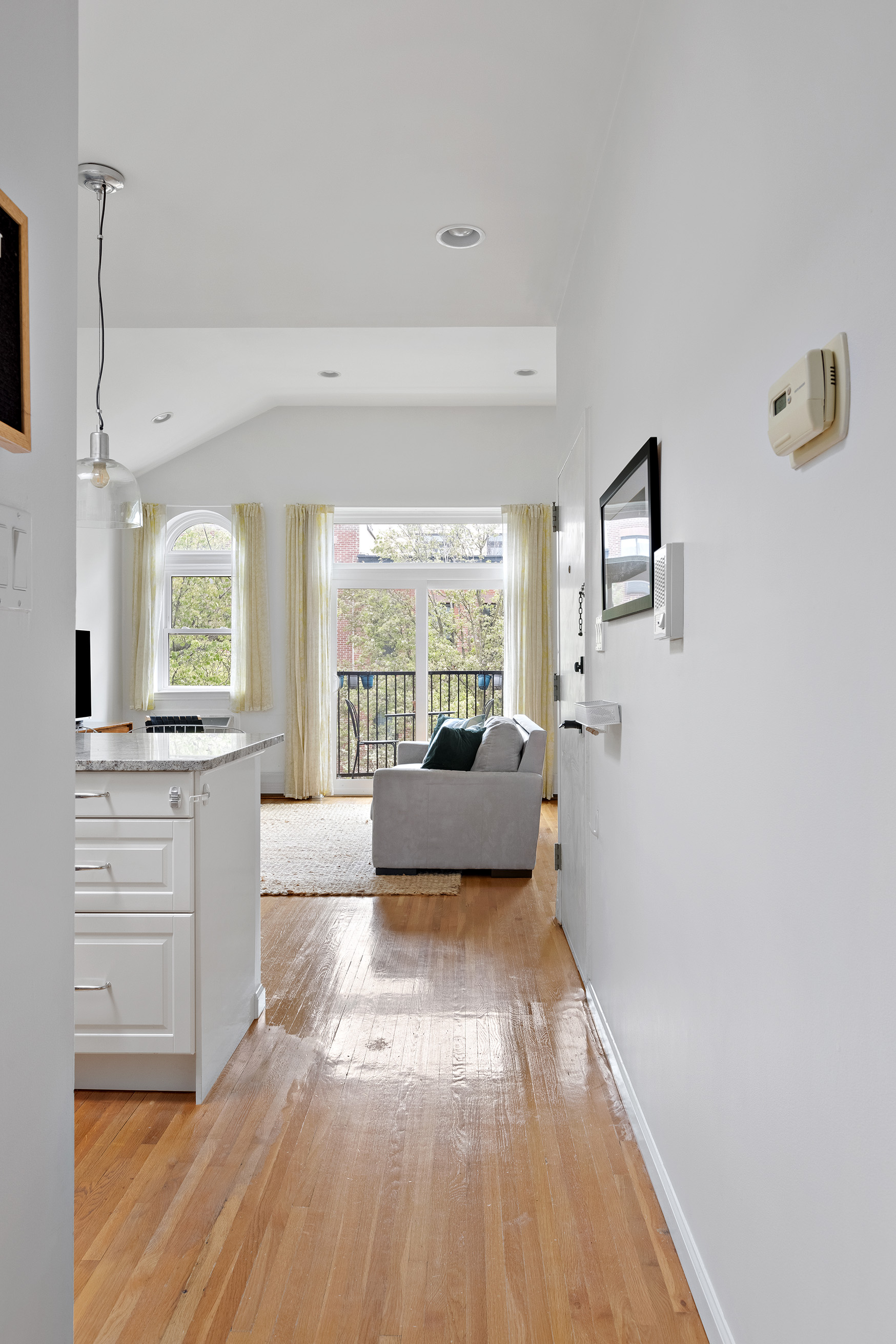 454 12th Street, Unit 3 Brooklyn, NY 11215 - Photo 6 of 18 a living room with furniture and a large window
