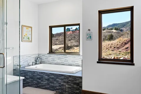 a spacious bedroom with a bed and a cabinets