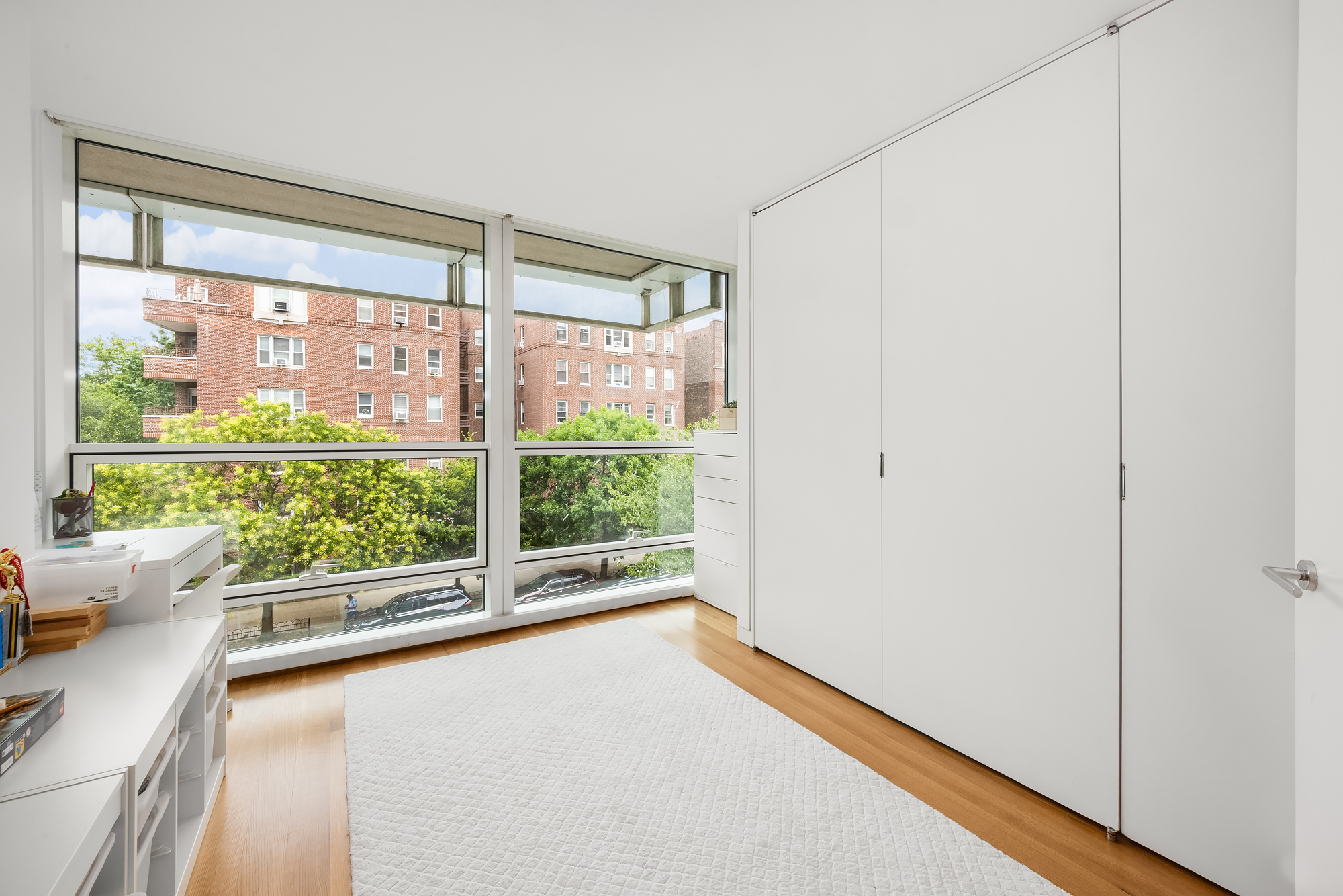 1 Grand Army Plaza, Unit 3C Brooklyn, NY 11238 - Photo 17 of 23 a view of a room with a large window