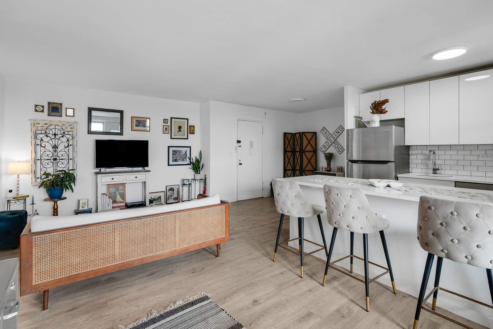 5800 Arlington Avenue, Unit 17D Bronx, NY 10471 - Photo 4 of 14 a living room with stainless steel appliances kitchen island granite countertop a sink and a flat screen tv