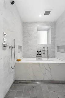 a bathroom with a bathtub and a sink