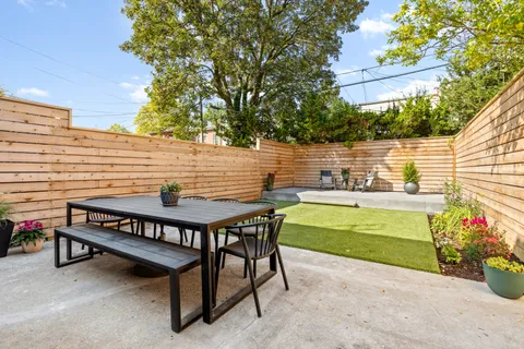 a view of a chairs and table in the patio