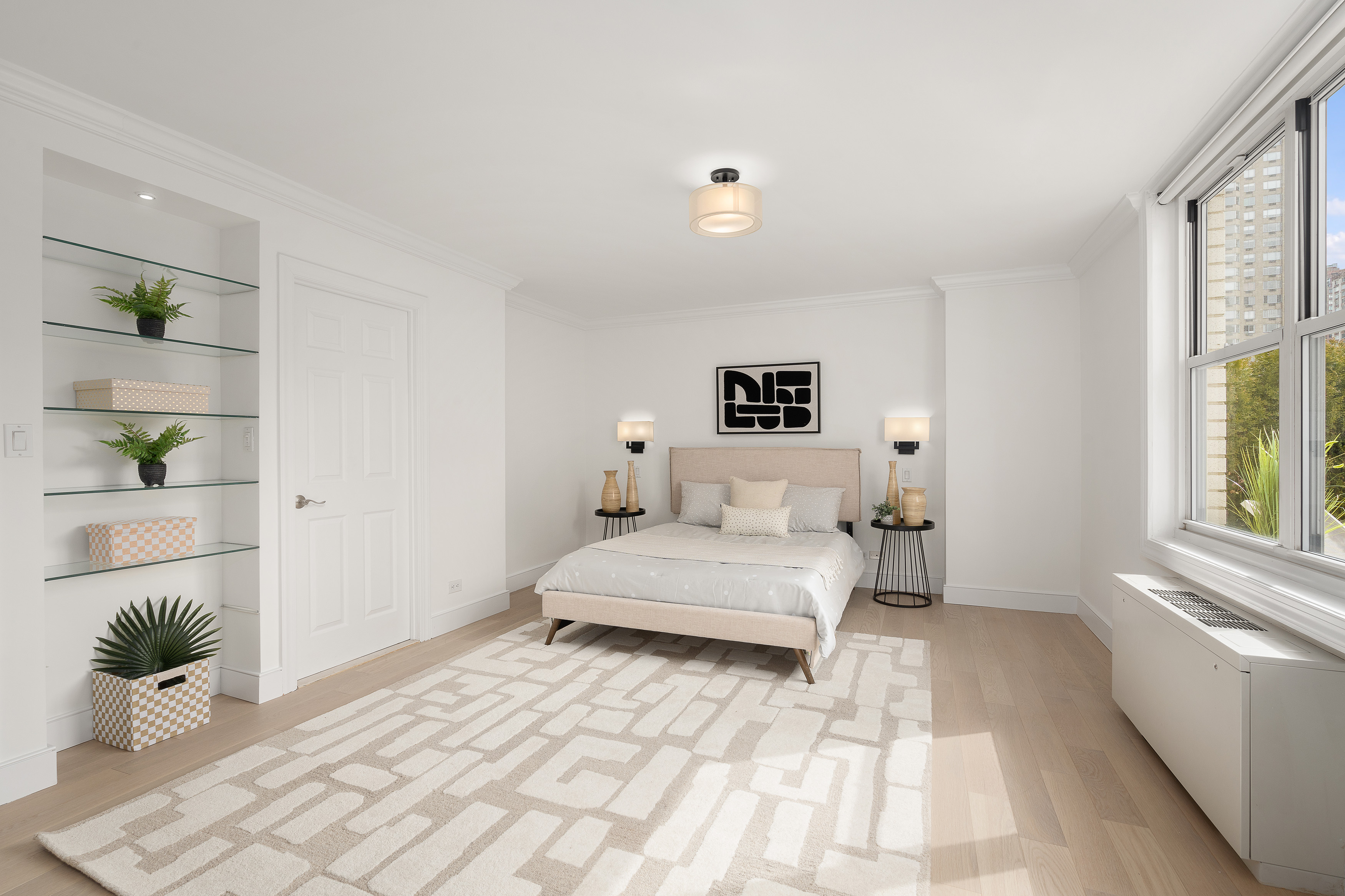 207 East 74th Street, Unit 11E Manhattan, NY 10021 - Photo 10 of 20 a bedroom with a large bed and a window