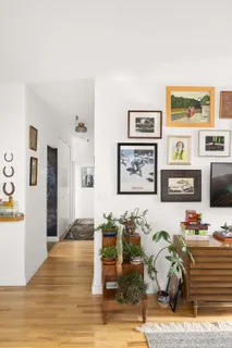 a bedroom with furniture and a wooden floor