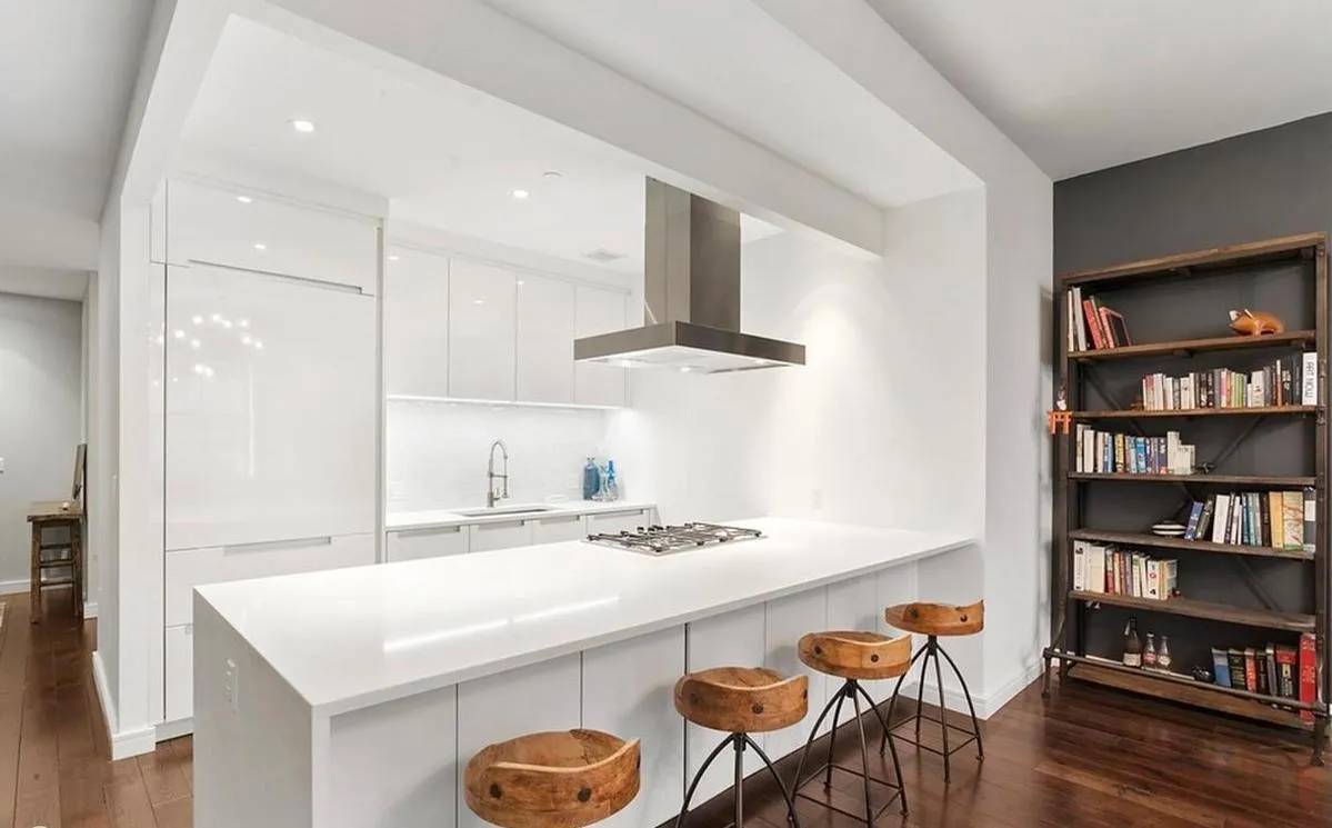 250 West Street, Unit 3F Manhattan, NY 10013 - Photo 3 of 11 a kitchen with a table and chairs
