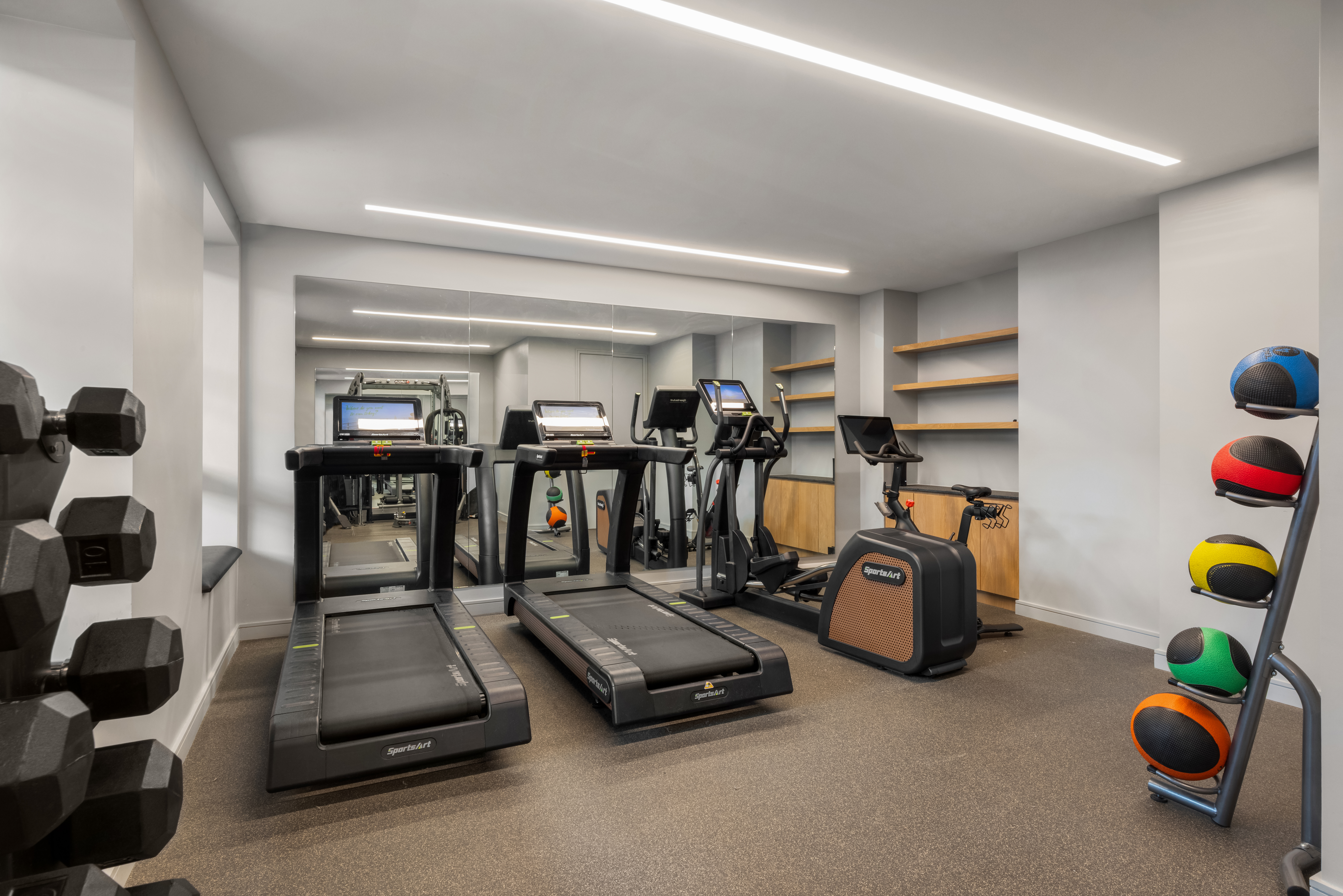 138 North 10th Street, Unit 302 Brooklyn, NY 11249 - Photo 12 of 15 a room with gym equipment and lots of windows