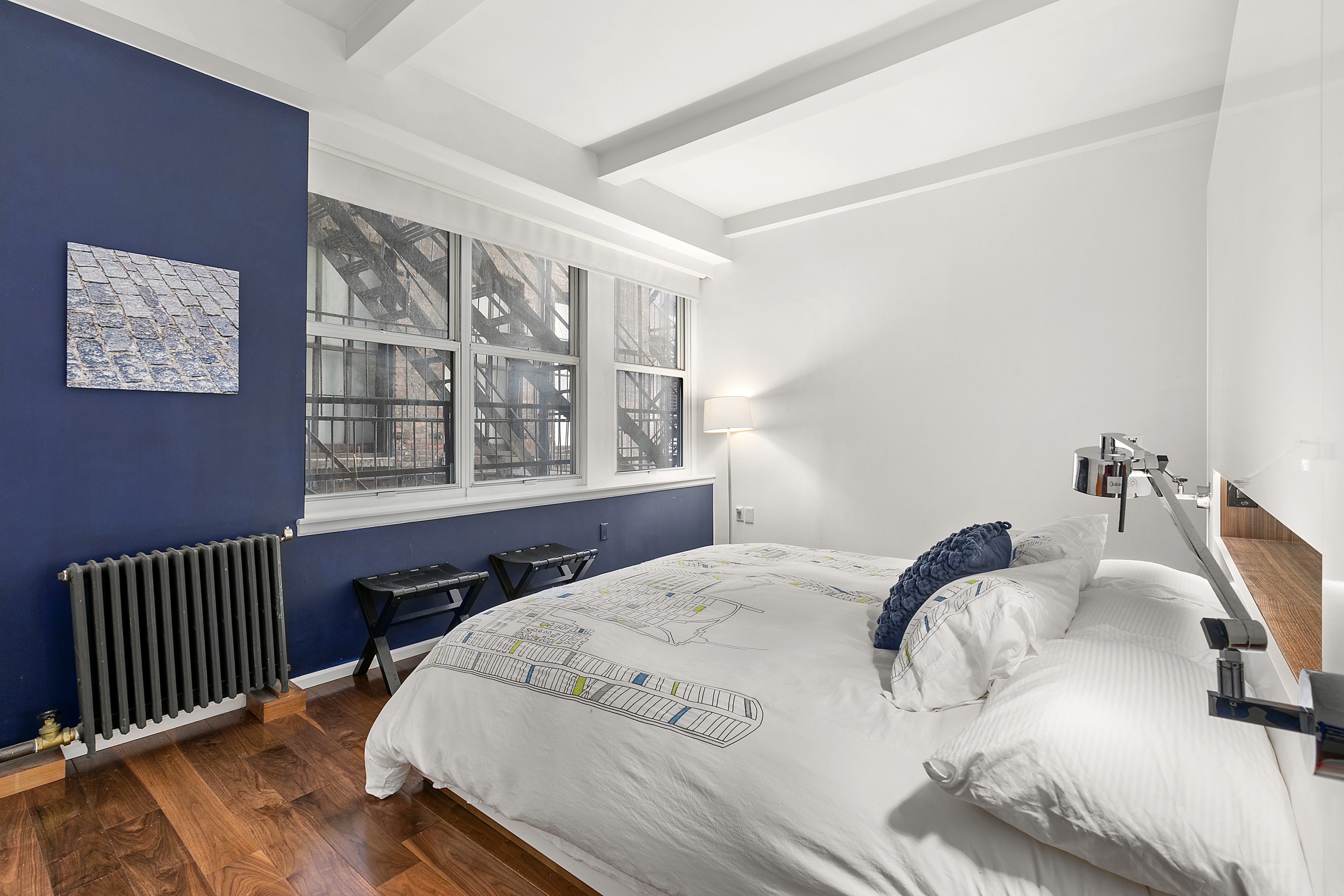 15 West 17th Street, Unit 6 Manhattan, NY 10011 - Photo 6 of 9 a bedroom with a bed and a window