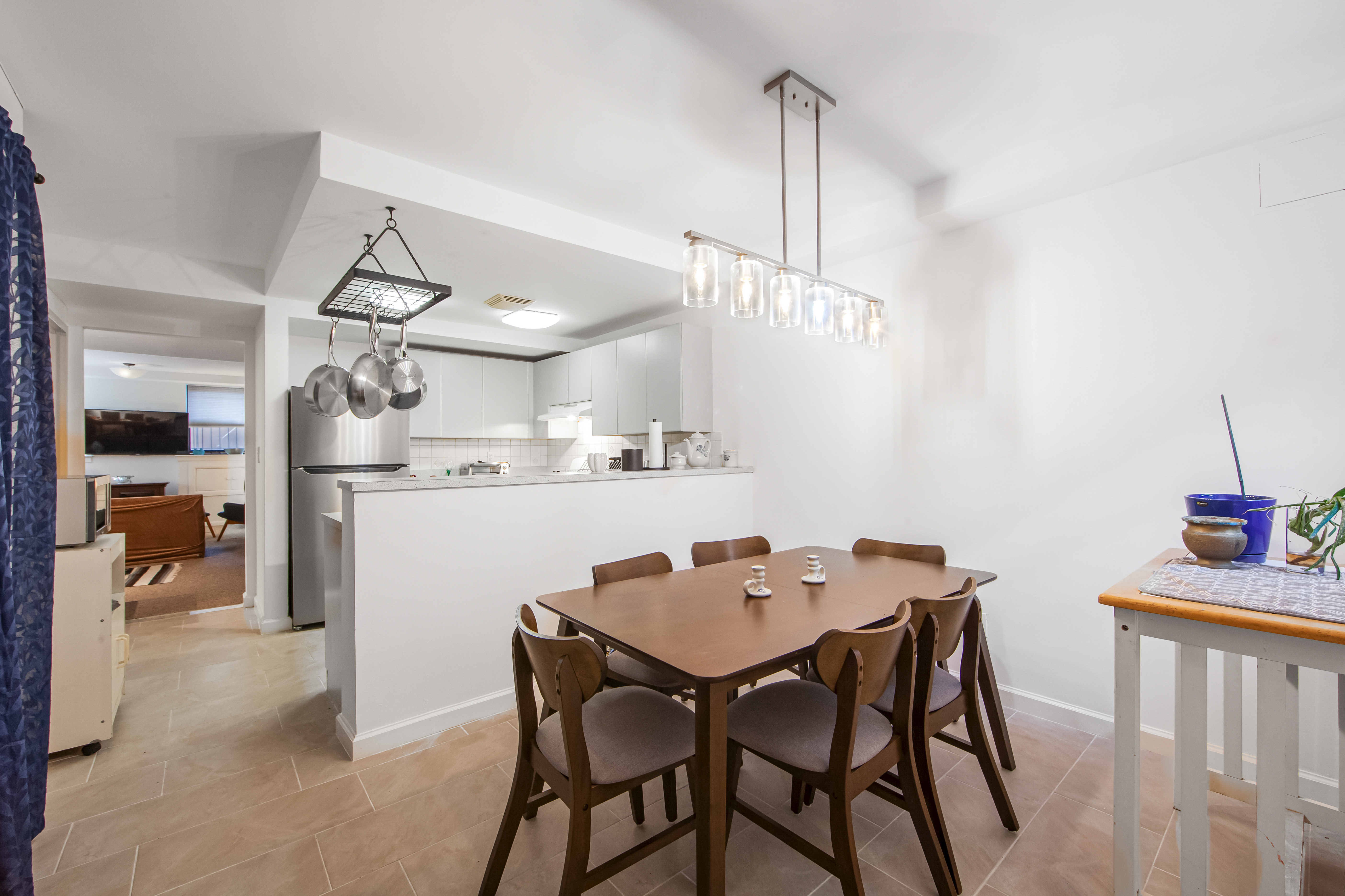 a kitchen with a table and chairs in it