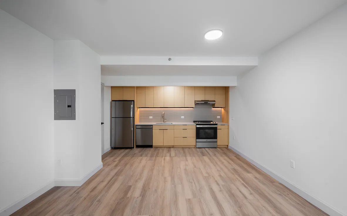 a view of a kitchen with wooden floor