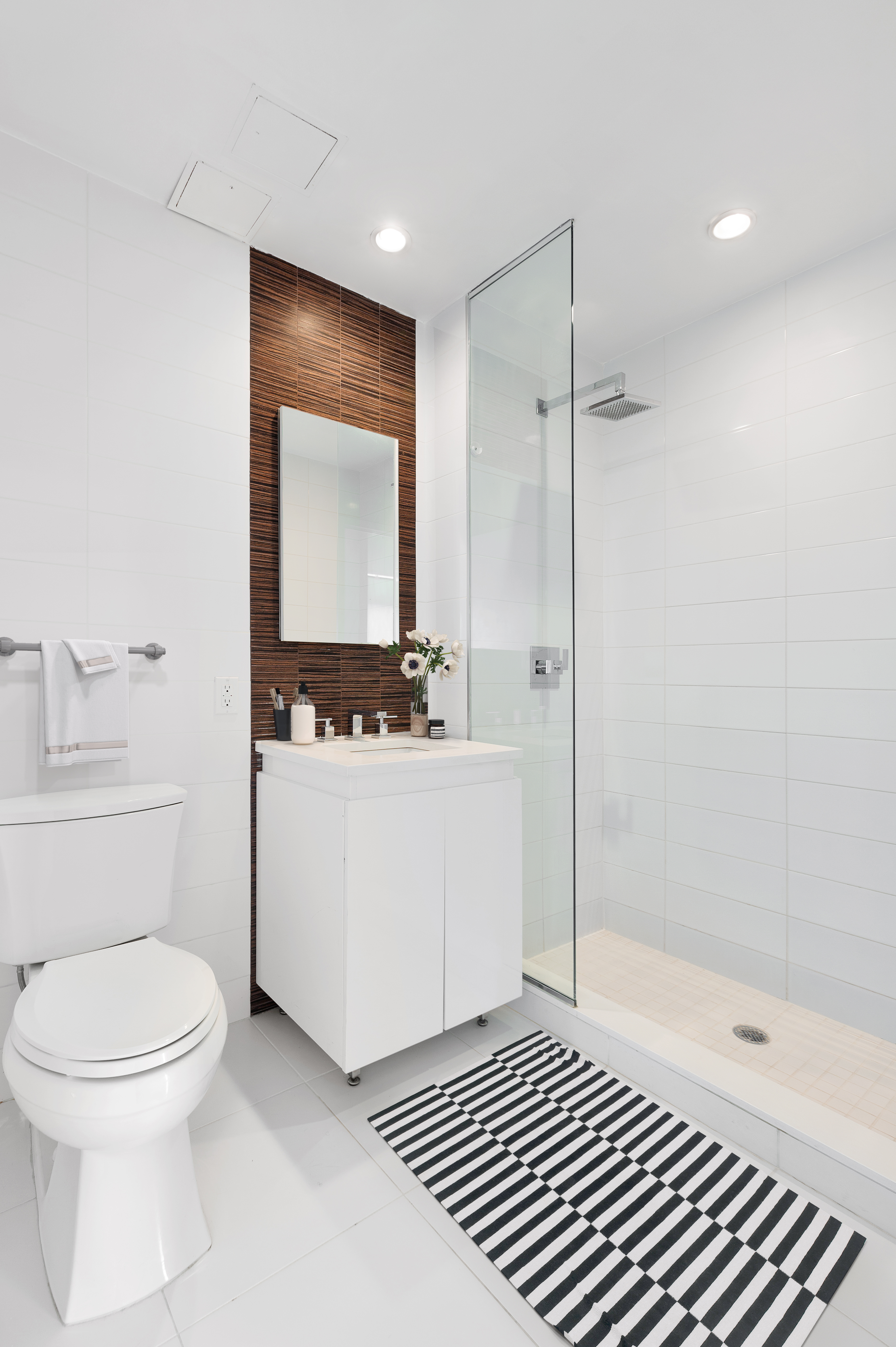 267 6th Street, Unit 4K Brooklyn, NY 11215 - Photo 6 of 17 a bathroom with a sink a toilet and shower