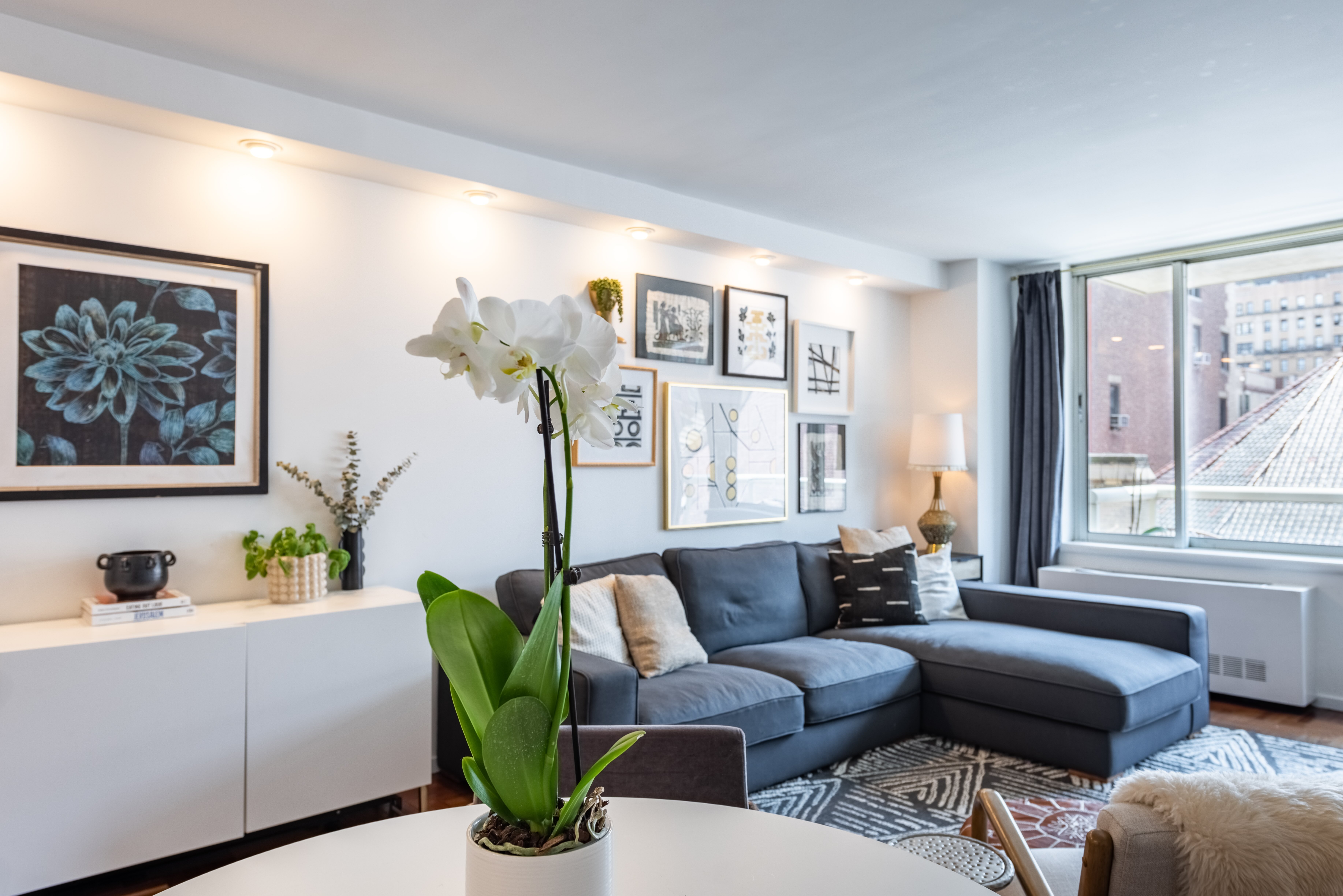 2373 Broadway, Unit 630 Manhattan, NY 10024 - Photo 4 of 17 a living room with furniture flowerpot and window