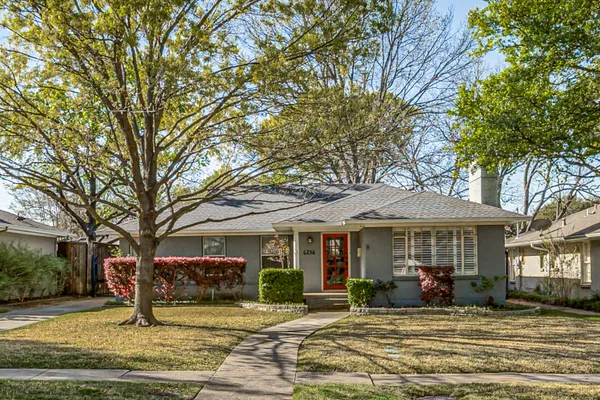 a front view of a house with swimming pool and porch with furniture