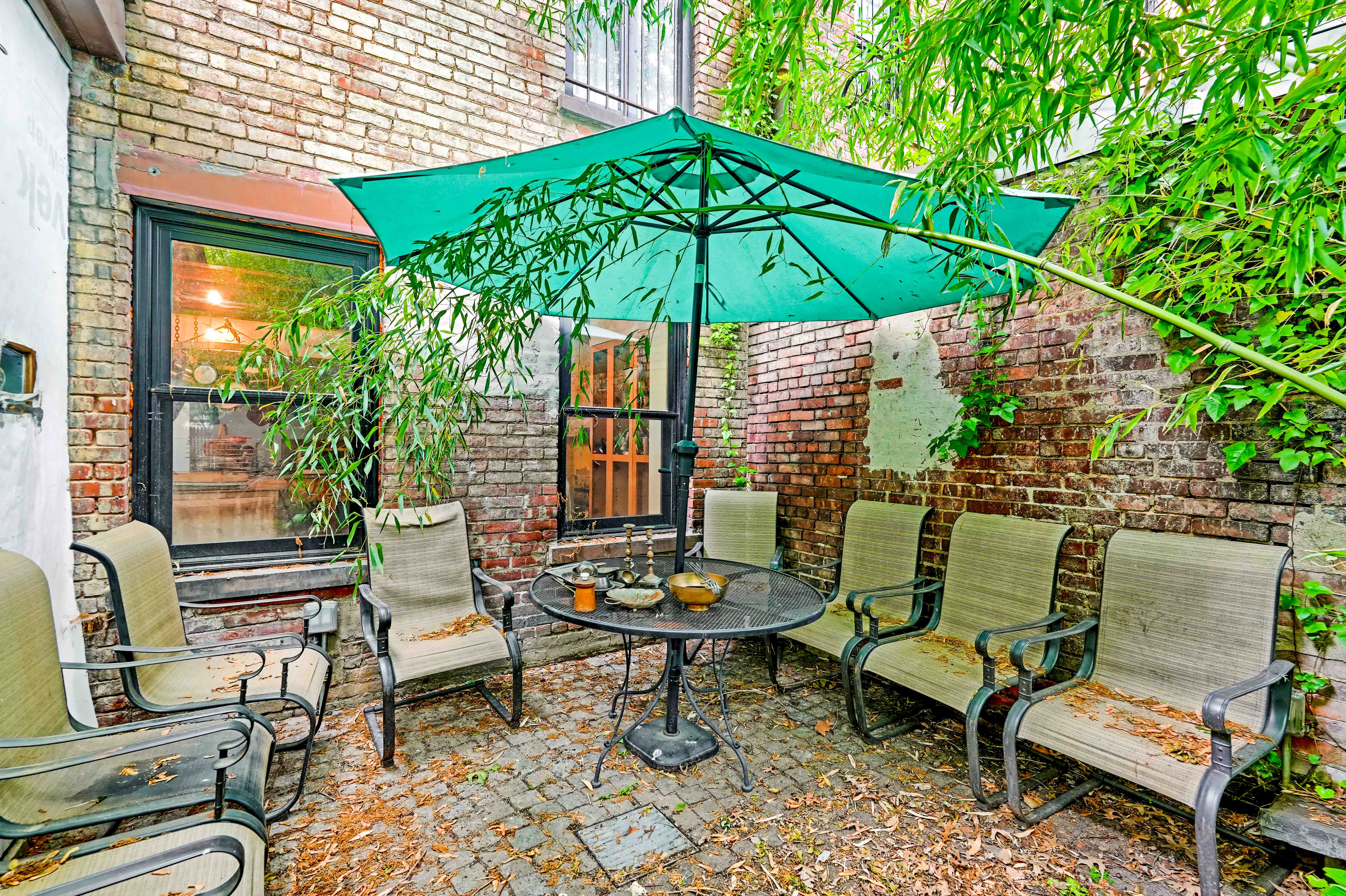 300 Lafayette Avenue Brooklyn, NY 11238 - Photo 16 of 17 a backyard of a house with table and chairs