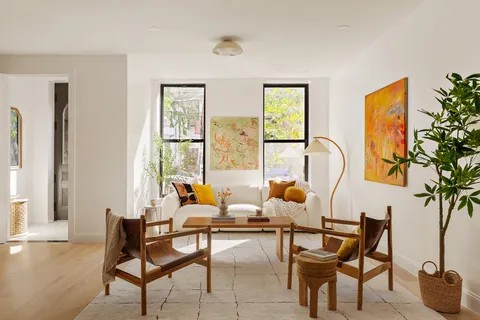 a living room with furniture and a window