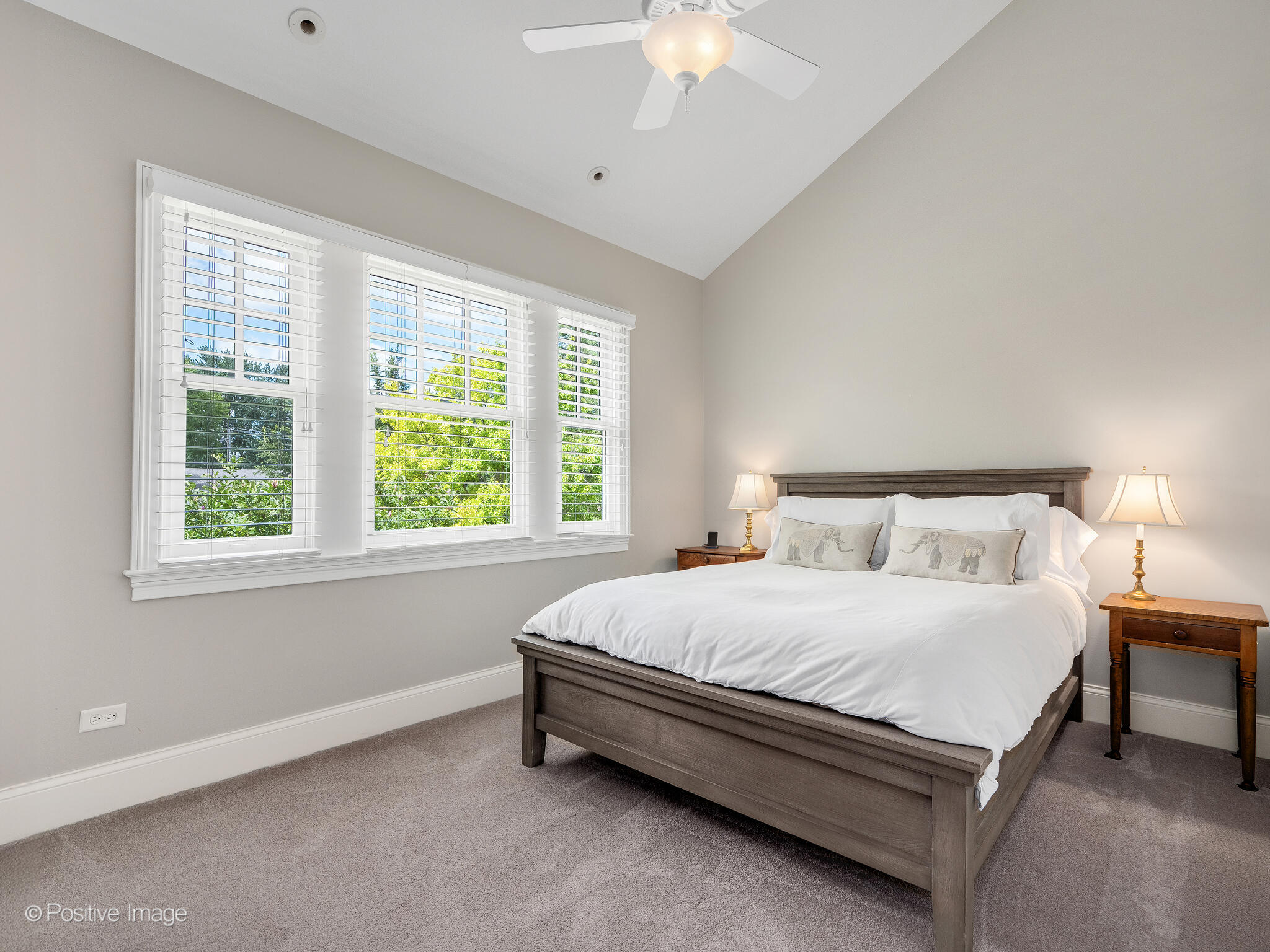 17 South Bruner Street Hinsdale, IL 60521 - Photo 27 of 42 a bedroom with a bed and a chandelier