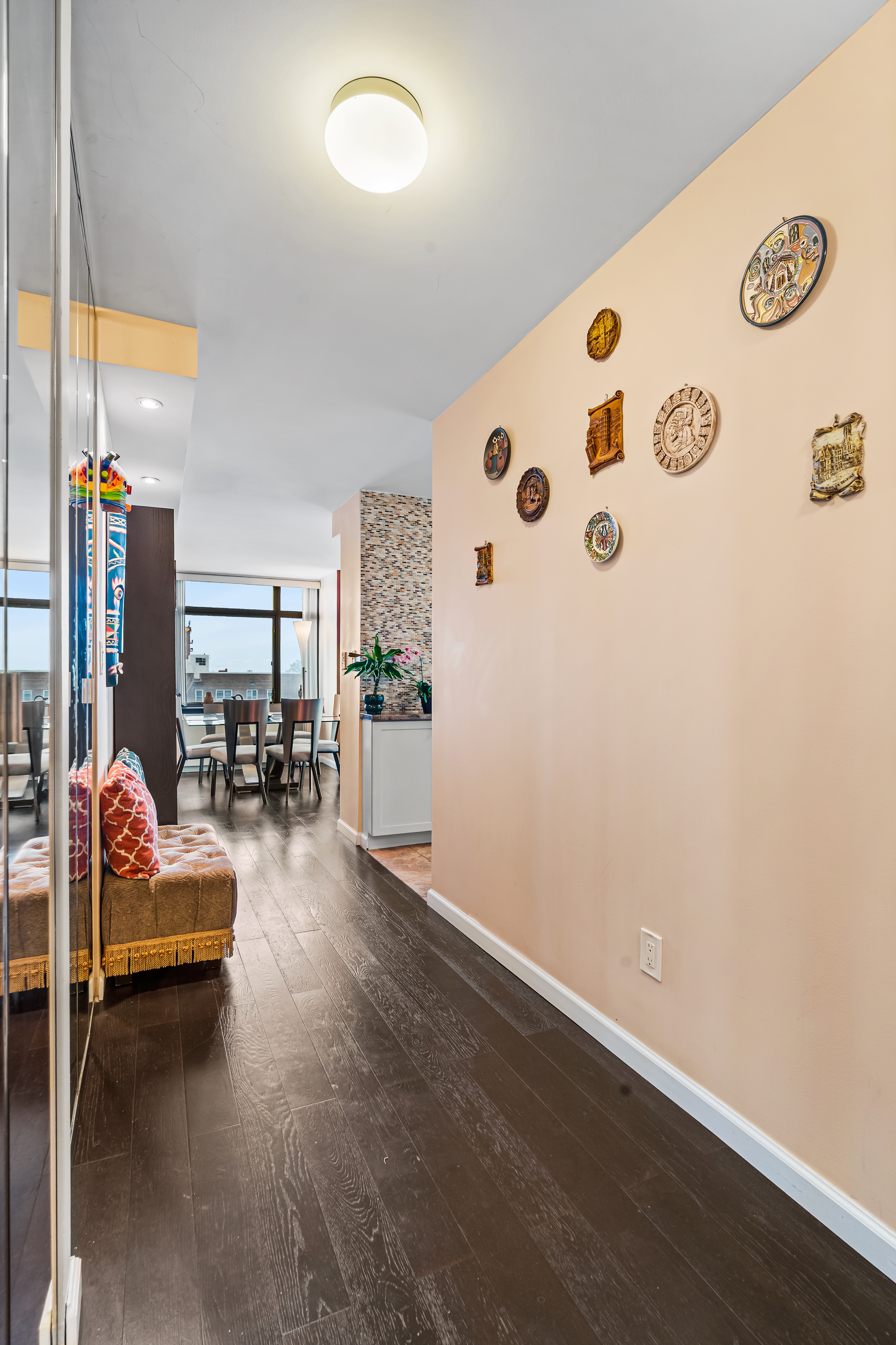 112-01 Queens Boulevard, Unit 6J Queens, NY 11375 - Photo 6 of 29 a living room with furniture and wooden floor