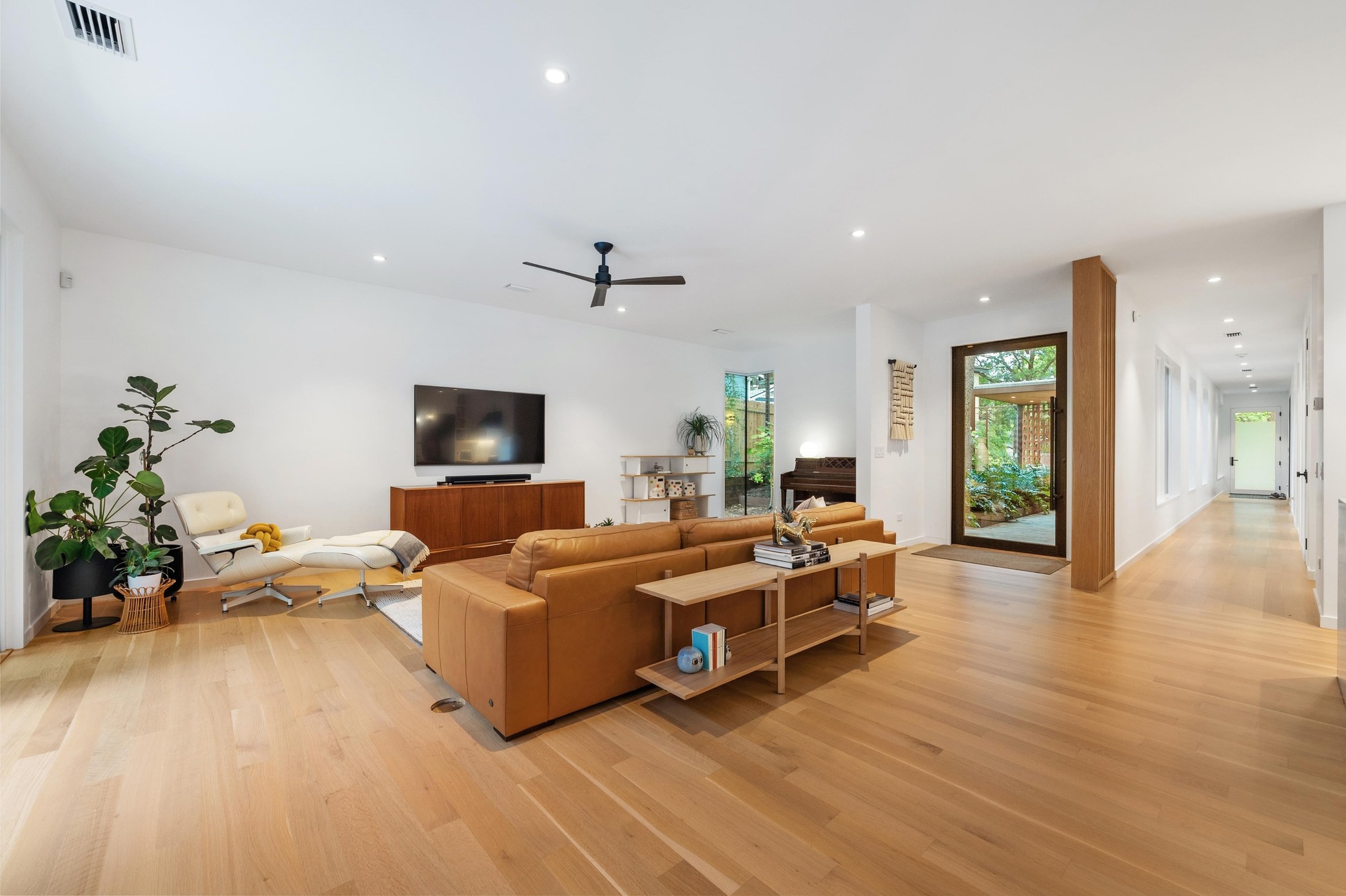 1206 Bickler Road Austin, TX 78704 - Photo 21 of 65 a living room with furniture and a flat screen tv