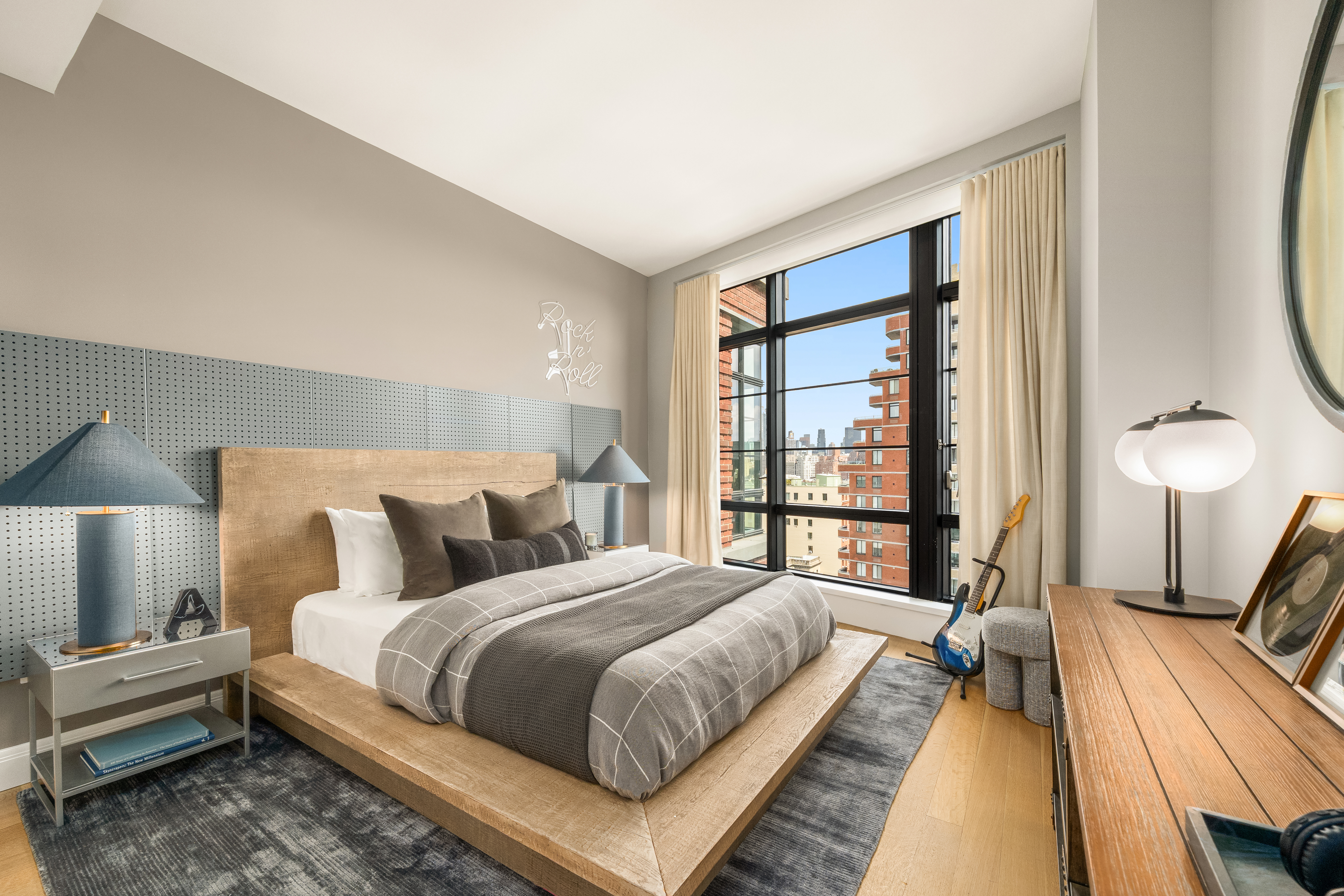 150 Charles Street, Unit 14B Manhattan, NY 10014 - Photo 12 of 20 a bedroom with a bed and a large window