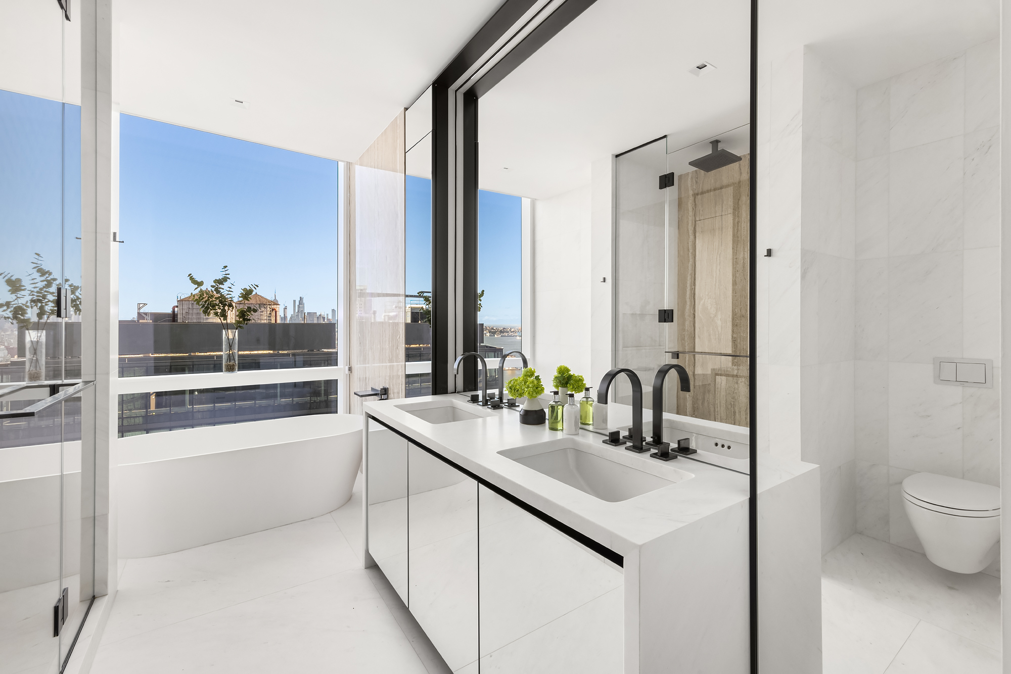 111 Murray Street, Unit 38A Manhattan, NY 10007 - Photo 13 of 29 a bathroom with a sink and a mirror with bathtub