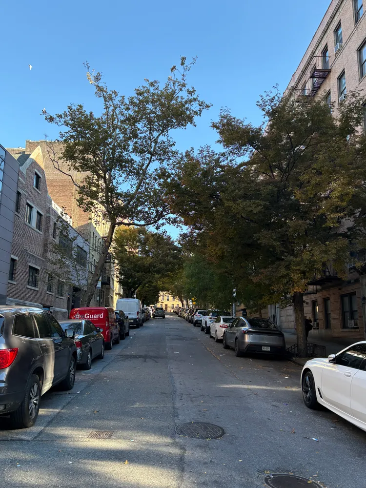 a view of street with parked cars