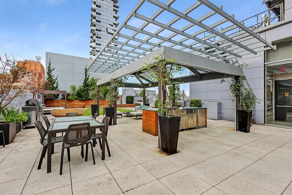 93 Worth Street, Unit 405 Manhattan, NY 10013 - Photo 7 of 18 a view of a patio with a table and chairs