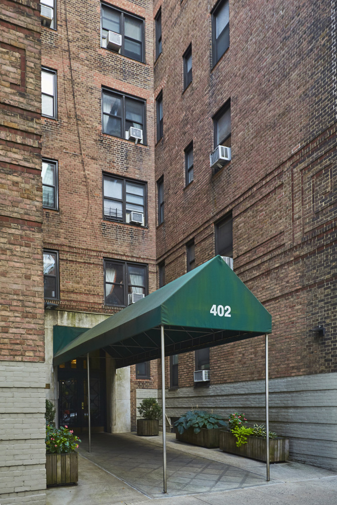 402 East 74th Street, Unit 4B Manhattan, NY 10021 - Photo 8 of 9 a front view of a building with entryway