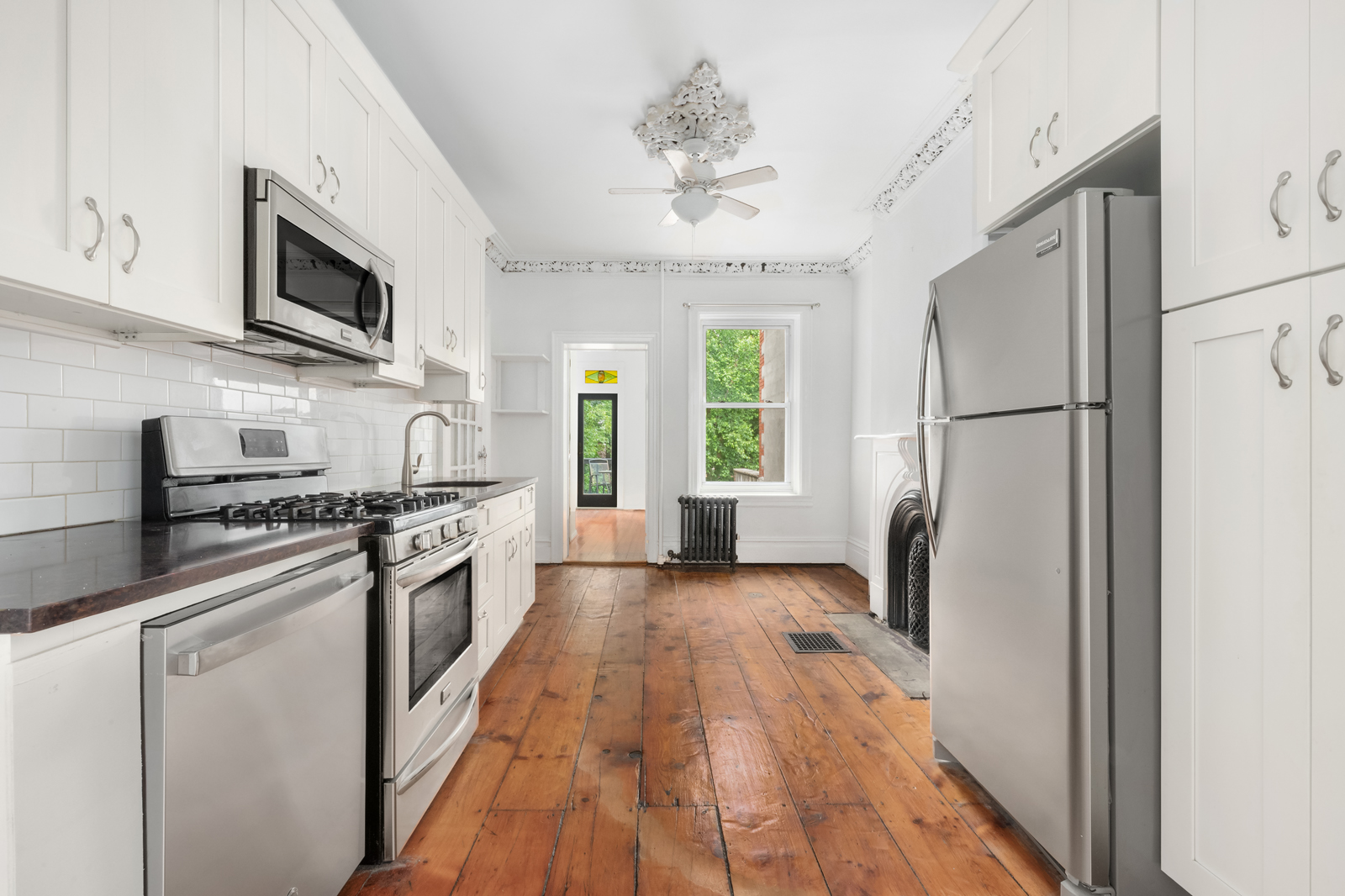 441 Union Street, Unit 2 Brooklyn, NY 11231 - Photo 3 of 11 a kitchen with stainless steel appliances a refrigerator stove and microwave