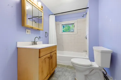 a kitchen with stainless steel appliances granite countertop a stove a refrigerator and a cabinets