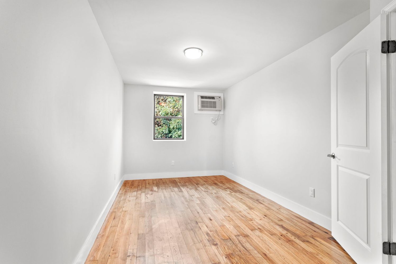791 Lexington Avenue, Unit 2 Brooklyn, NY 11221 - Photo 14 of 19 an empty room with windows