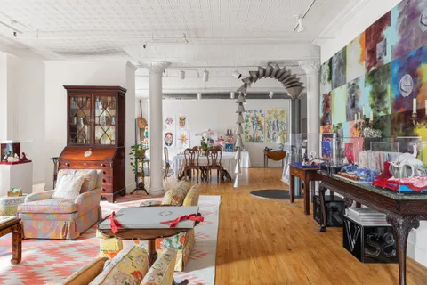 a very nice looking living room with furniture and wooden floor